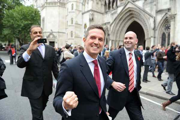 Pic Colin Lane Christian Purslow fisted salute outside court, london