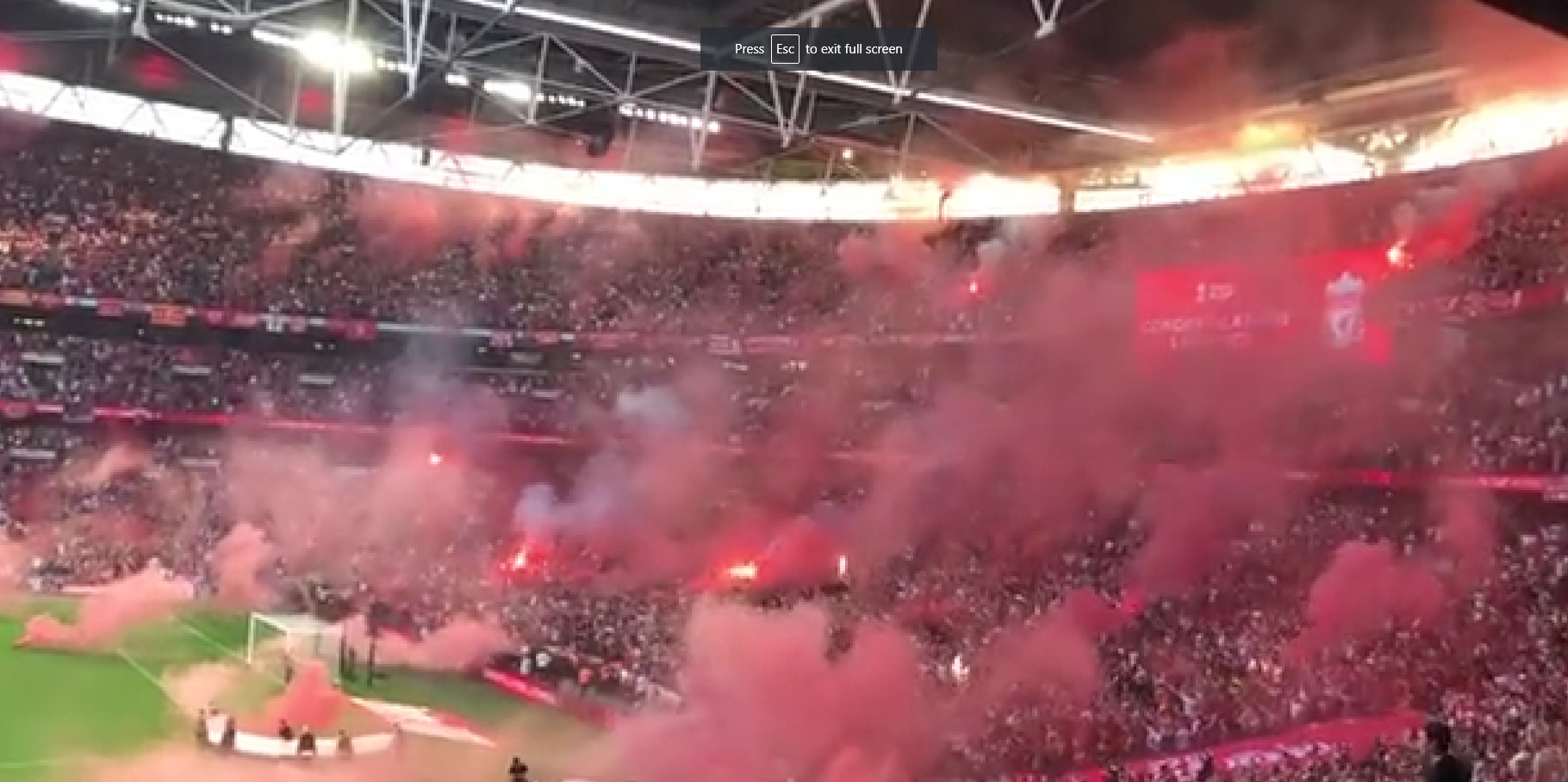 (Video) Unbelievable scenes at Wembley as red haze of flare smoke covers Liverpool fan section after FA Cup win