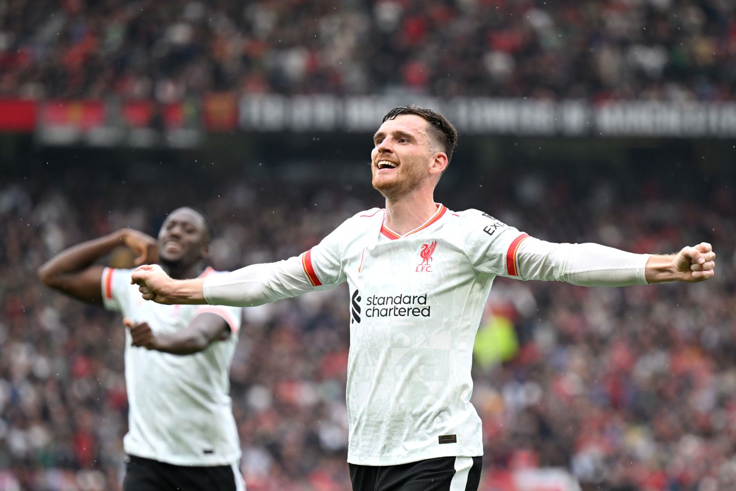 Andy Robertson celebrates a goal for Liverpool