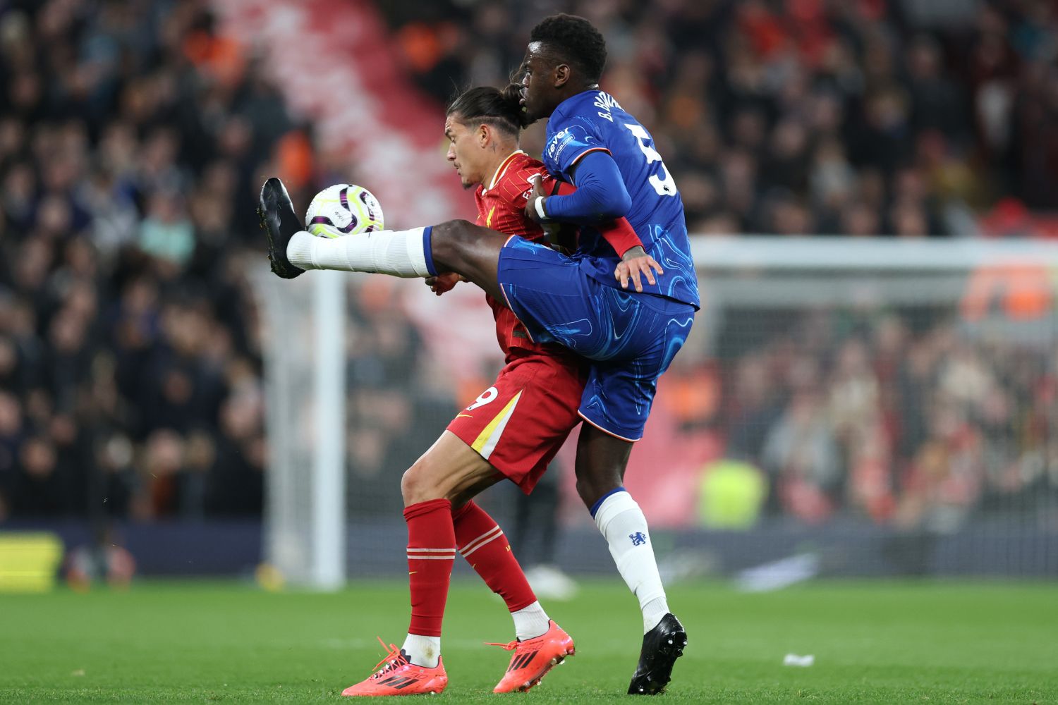 Darwin Nunez and Benoit Badiashile compete for the ball
