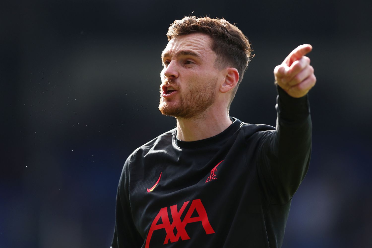 Andrew Robertson of Liverpool gives the team instructions as they warm up prior to the Premier League match between Crystal Palace FC and Liverpool FC at Selhurst Park on October 05, 2024 in London, England.