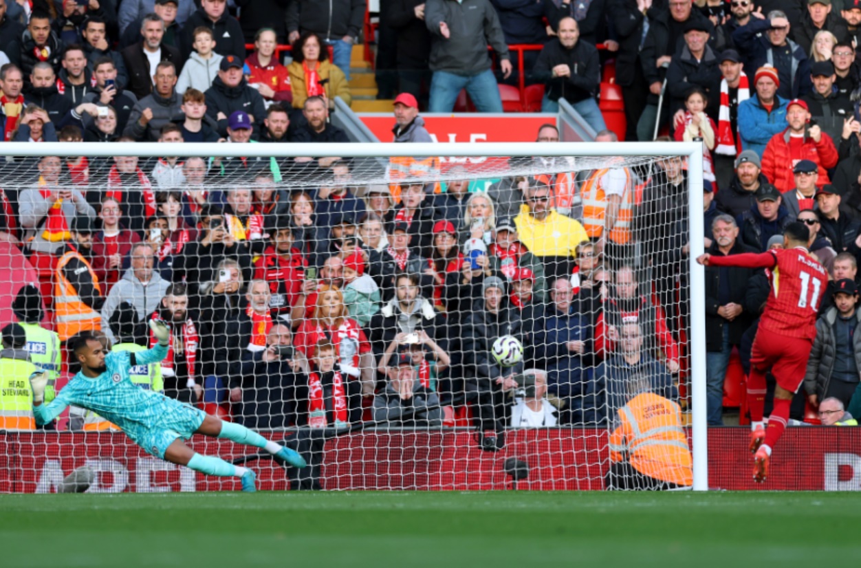 Mo Salah scores from the penalty spot to give Liverpool the lead against Chelsea