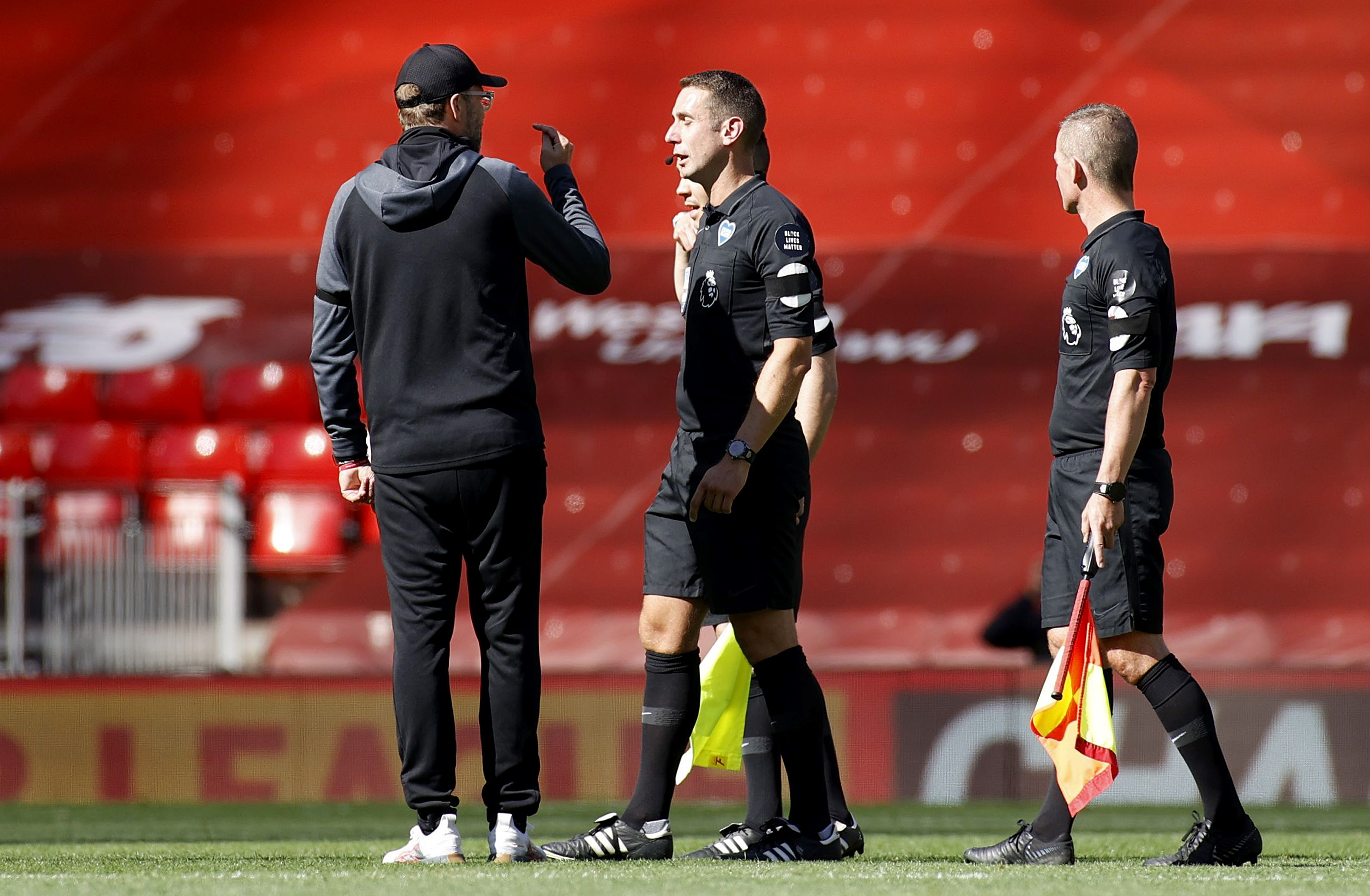 Jurgen Klopp remonstrates with David Coote after Liverpool's draw against Burnley in July 2020