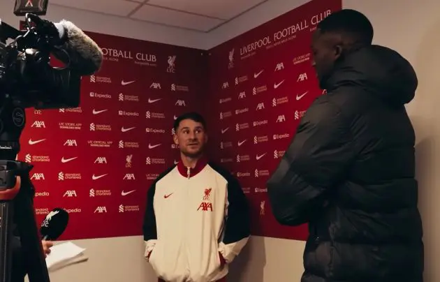 Ibou Konate jokes with Alexis Mac Allister after the win over Aston Villa