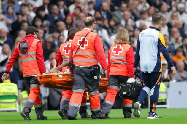 Eder Militao is stretchered off with an ACL injury