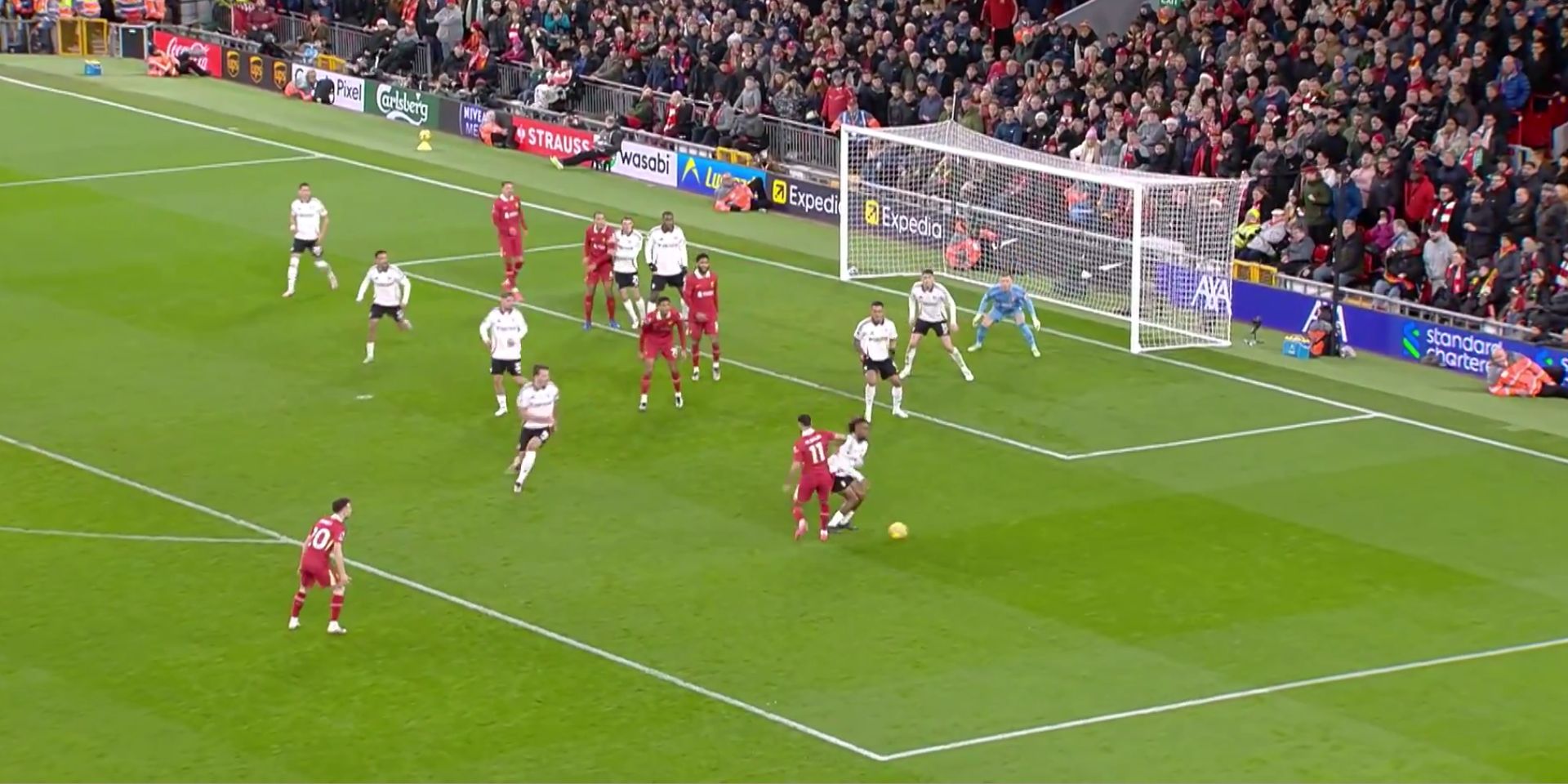 Alex Iwobi is floored at Anfield