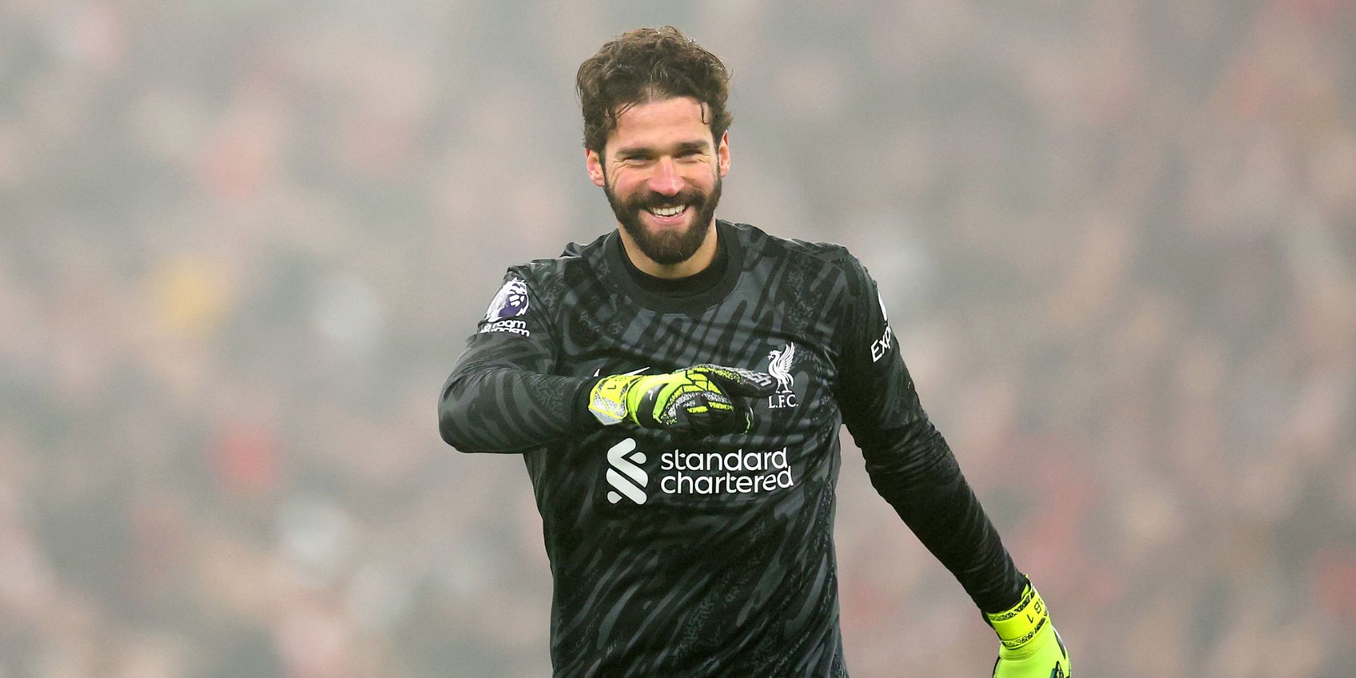 Alisson celebrates at Anfield