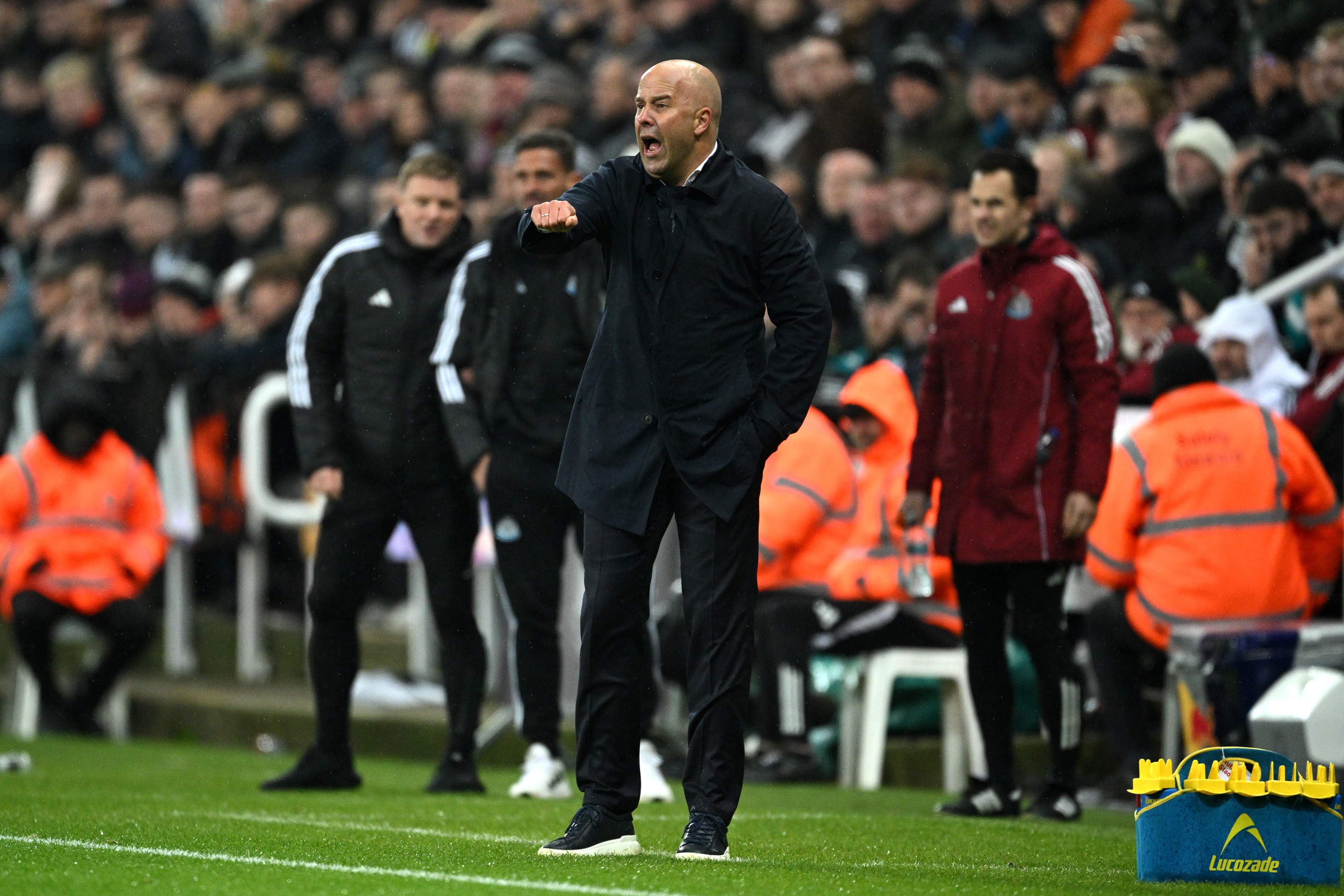 Arne Slot issues instructions to his players during Liverpool v Newcastle.