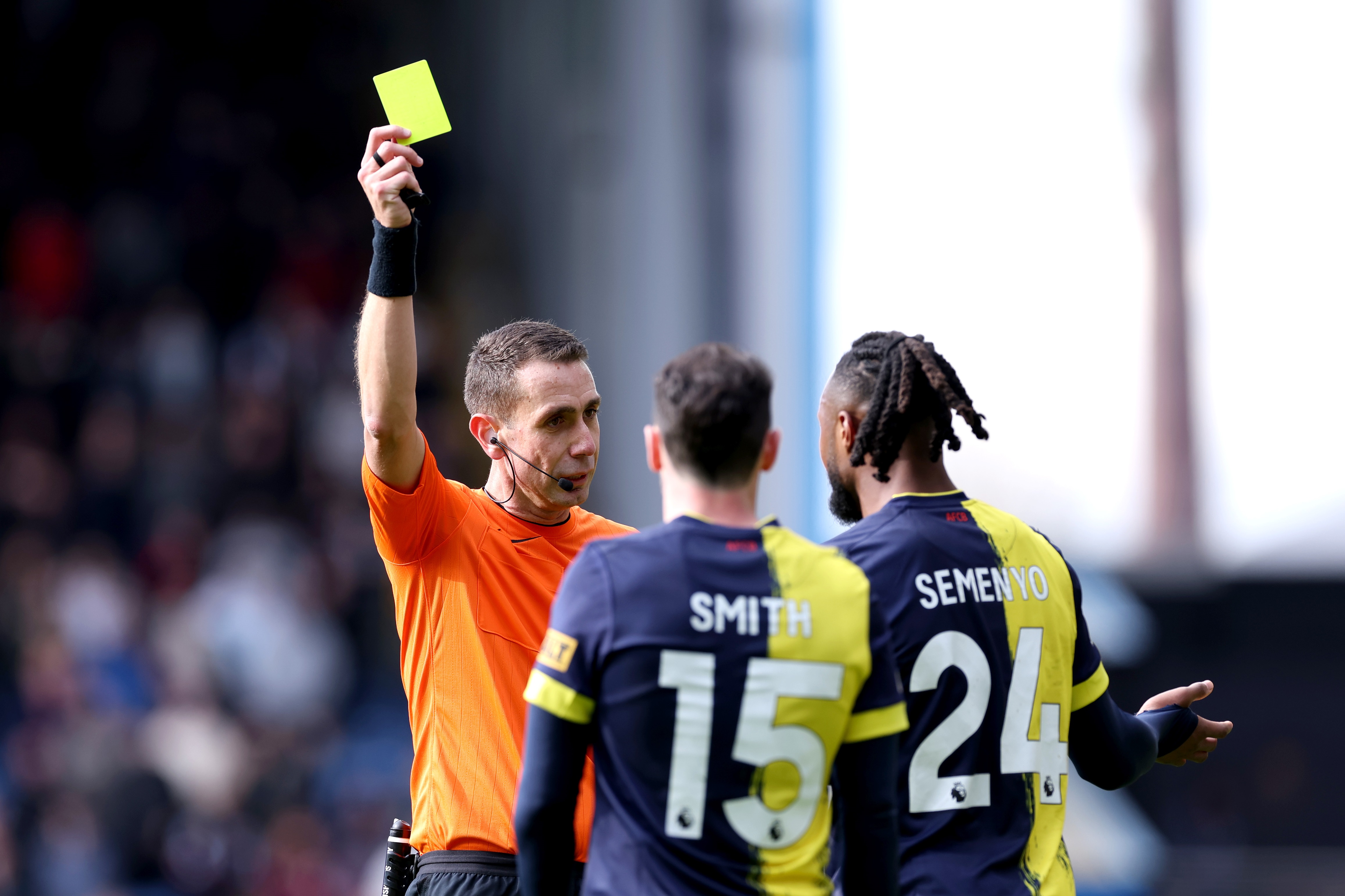 David Coote issues a yellow card during Bournemouth game.