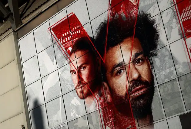 Mo Salah and Alexis Mac Allister's faces on Anfield Stadium.