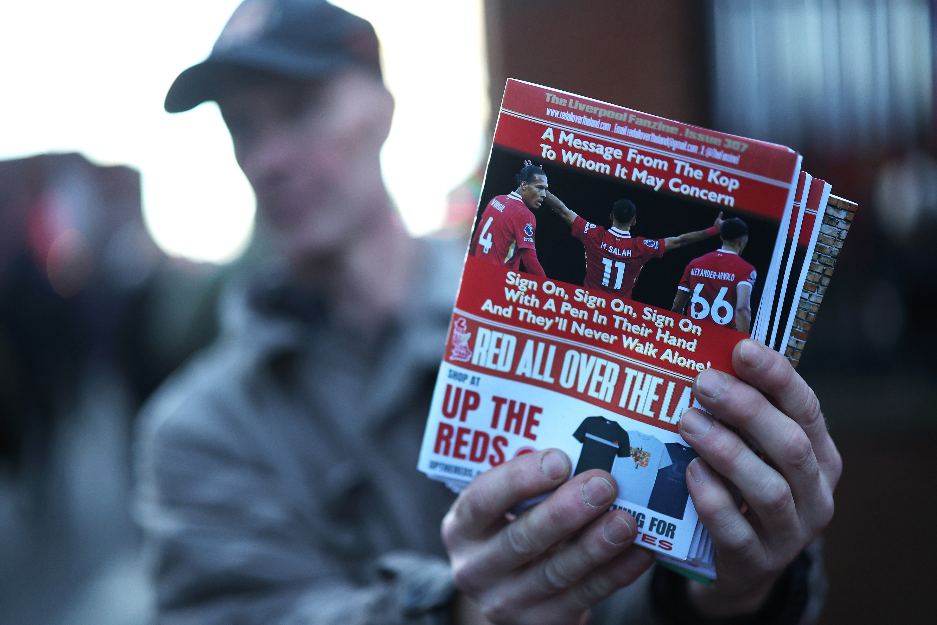 Liverpool fanzine showing the images of Virgil van Dijk, Trent Alexander-Arnold and Mo Salah.