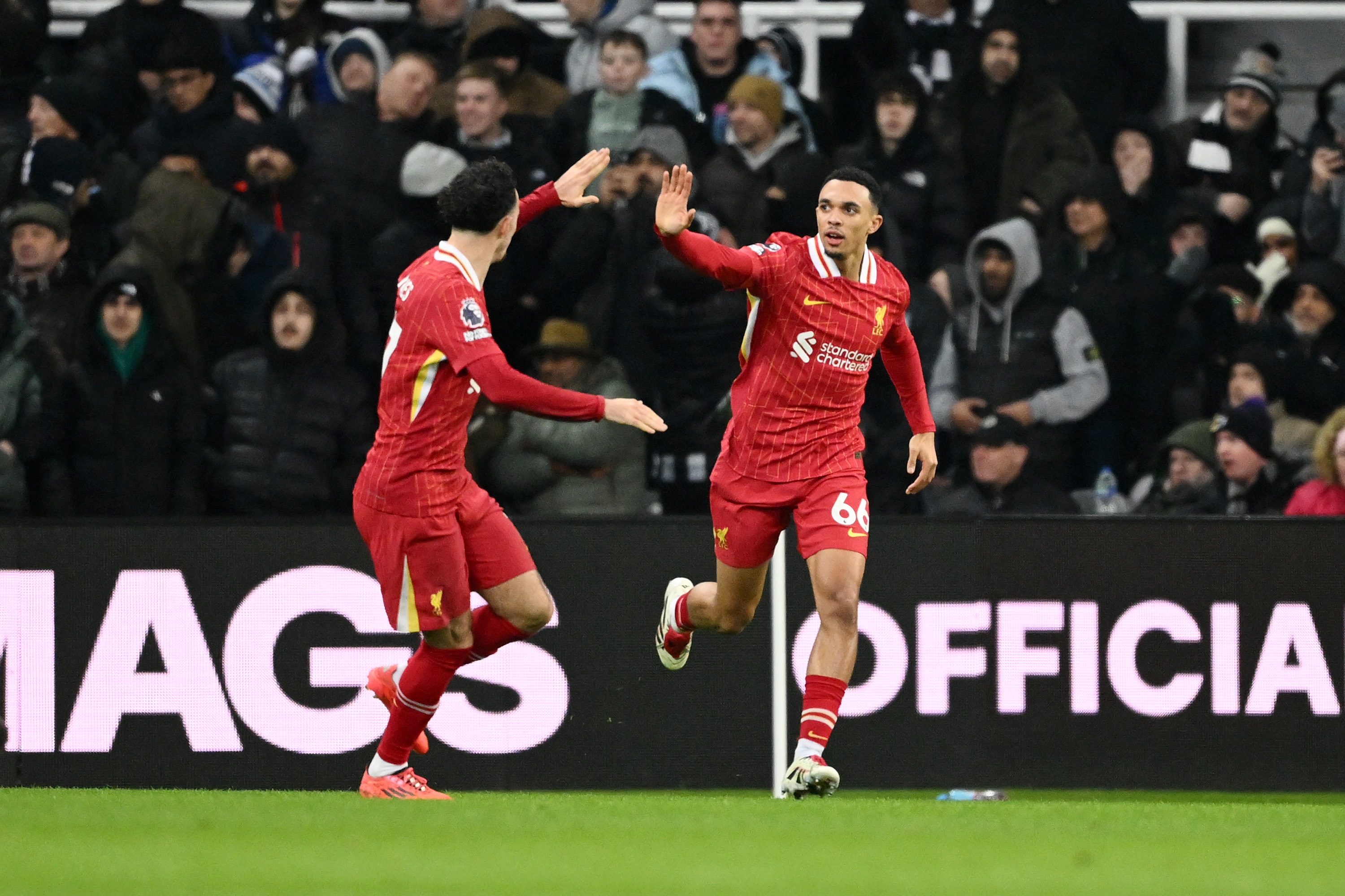 Trent Alexander-Arnold celebrates providing an assist for Mo Salah with Curtis Jones.