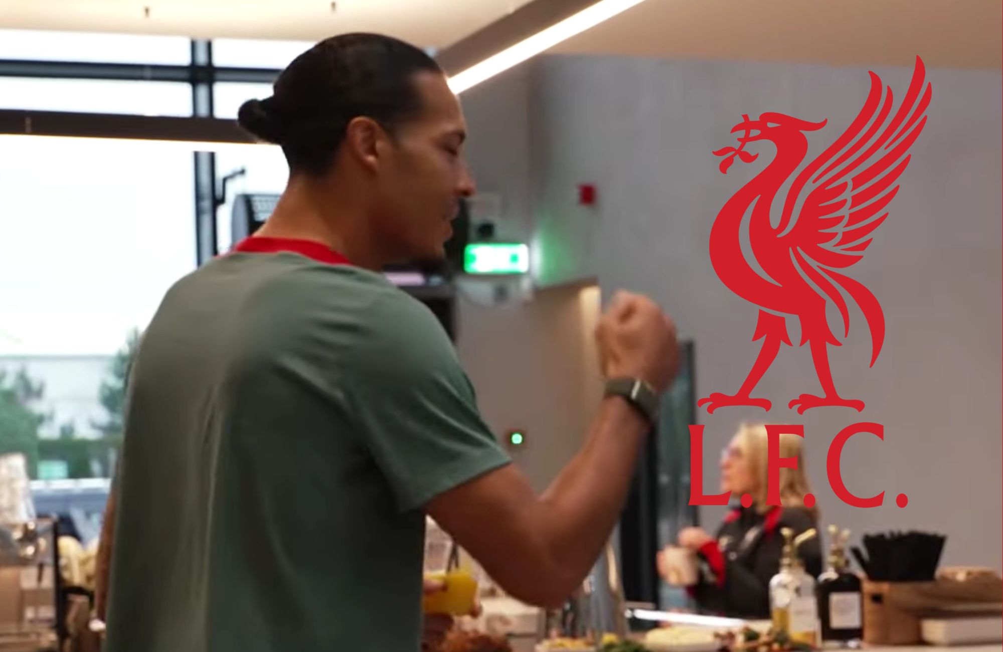 Virgil van Dijk celebrates with a fist-pump at the AXA training centre.