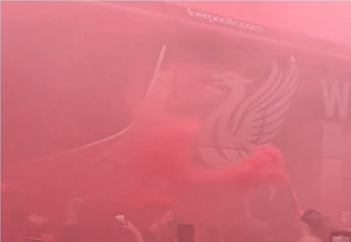 Liverpool fans greet the team bus before the clash against Man City