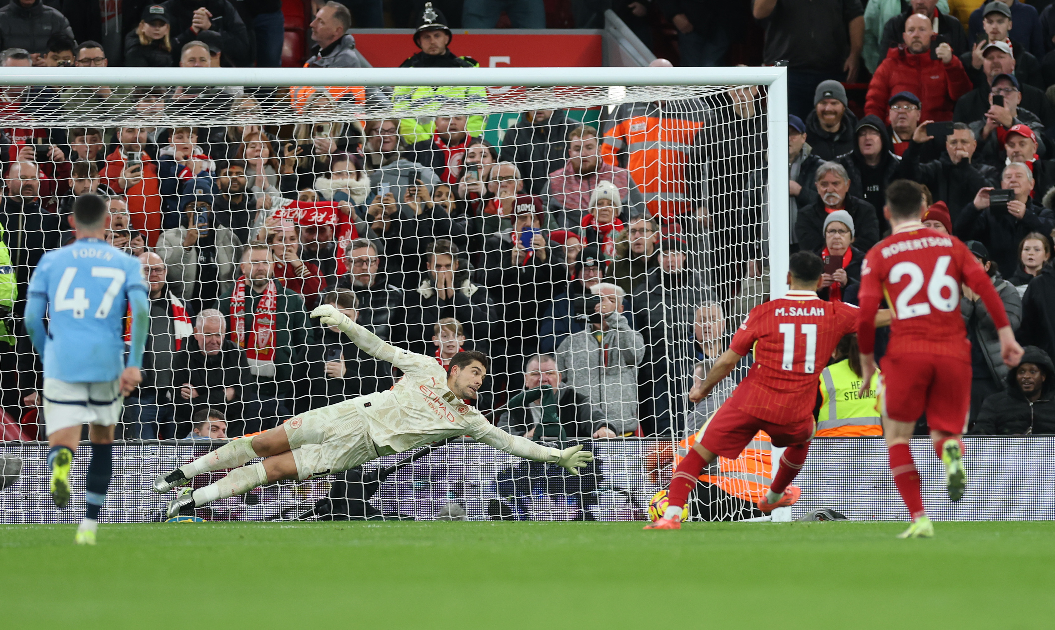 Mo Salah scores his penalty against Manchester City.