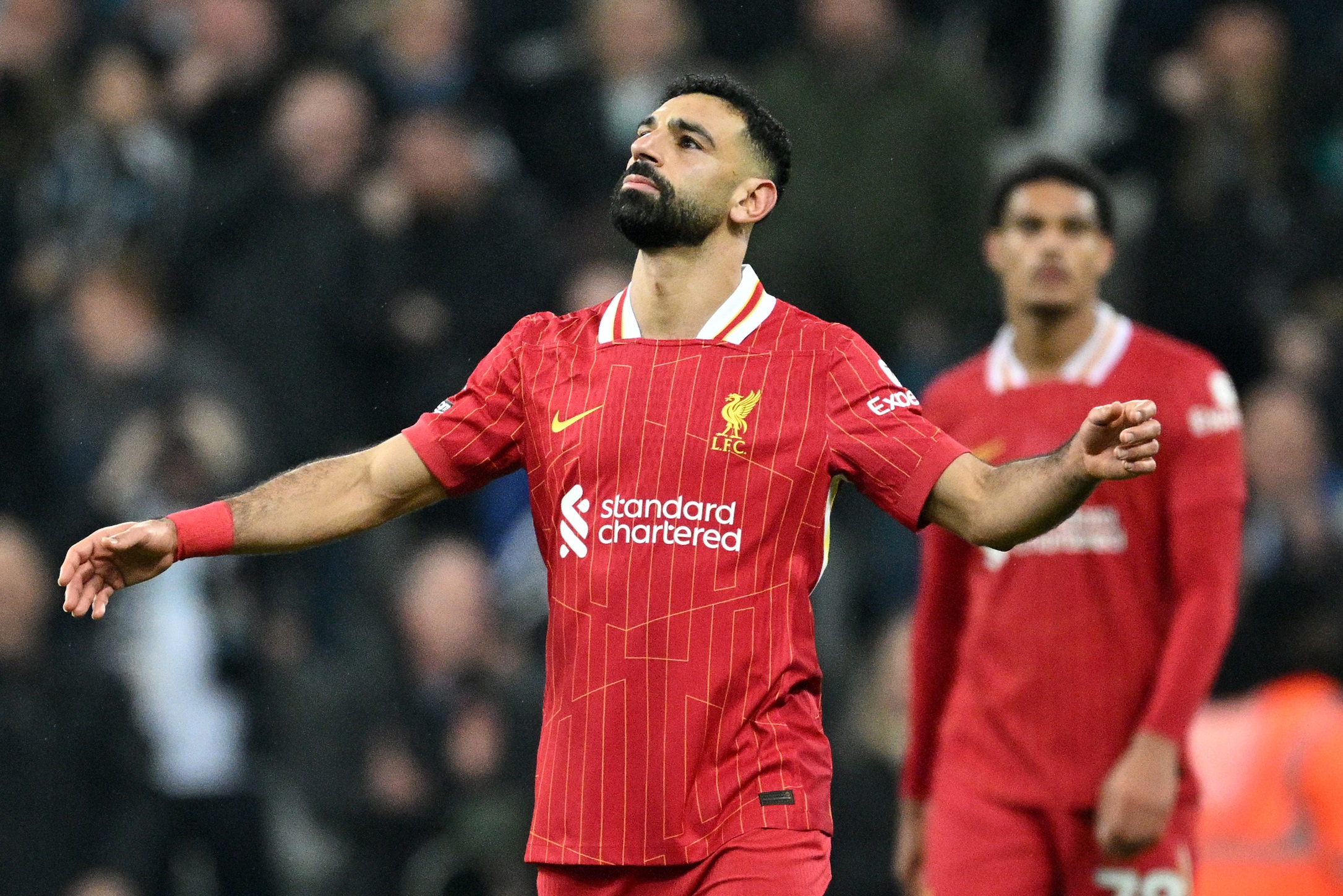 Mo Salah reacts after scoring against Newcastle United at St James' Park.