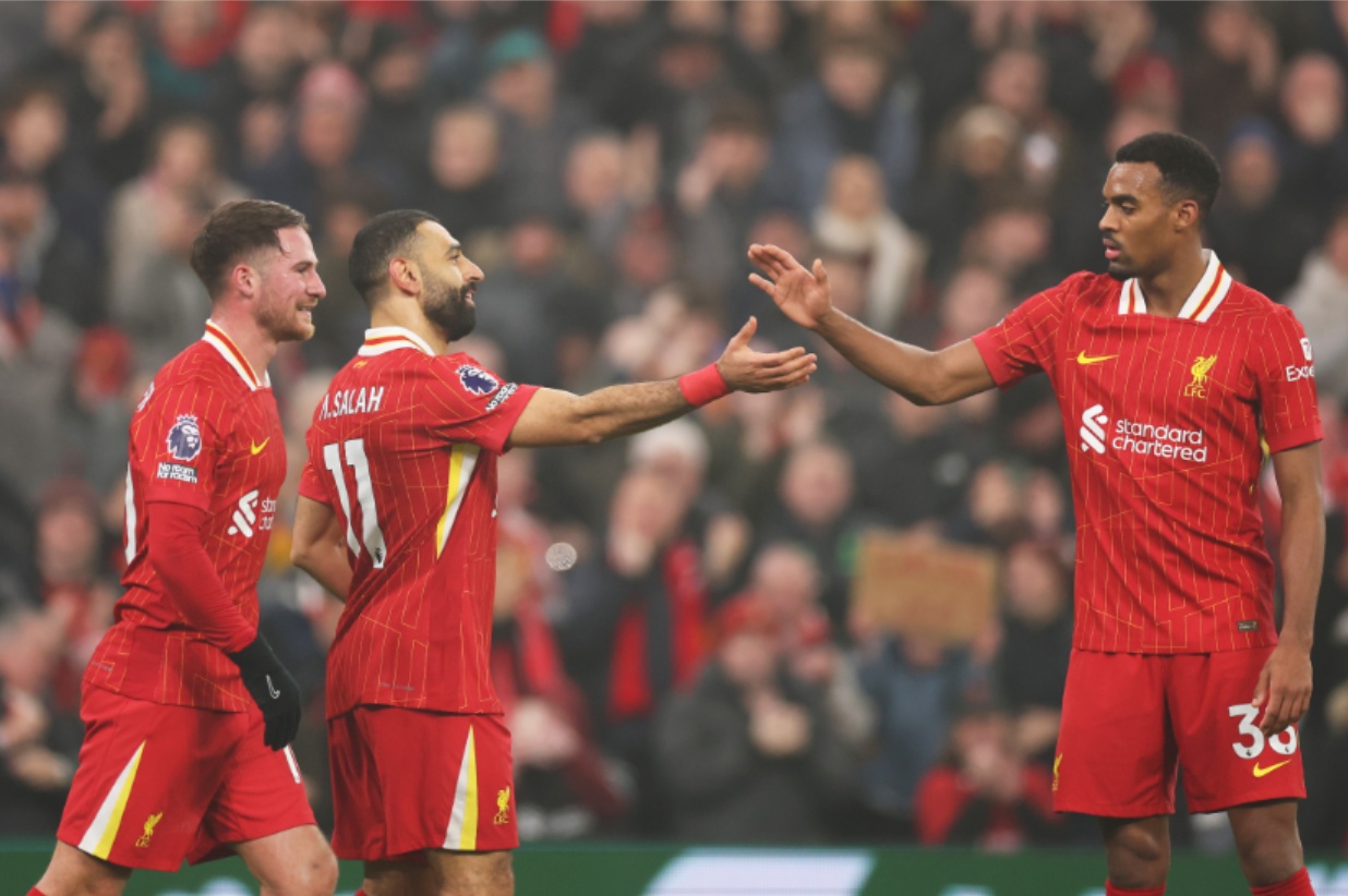 Liverpool celebrate extending their lead at the Premier League summit