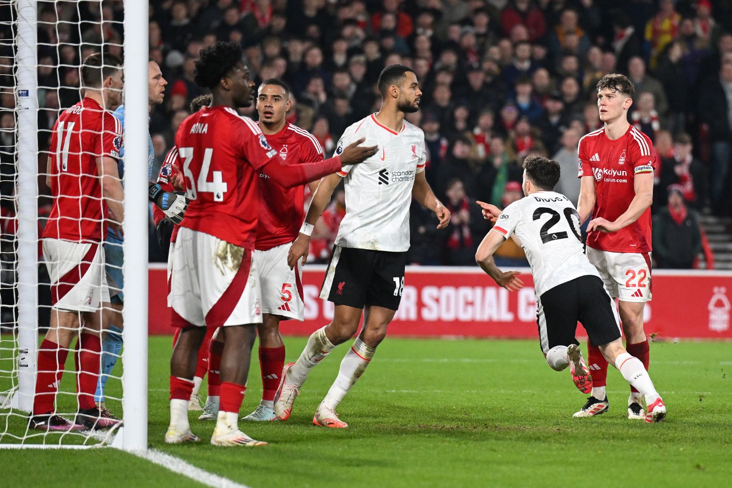 Diogo Jota runs to Kostas Tsimikas to celebrate Liverpool's goal against Nottingham Forest