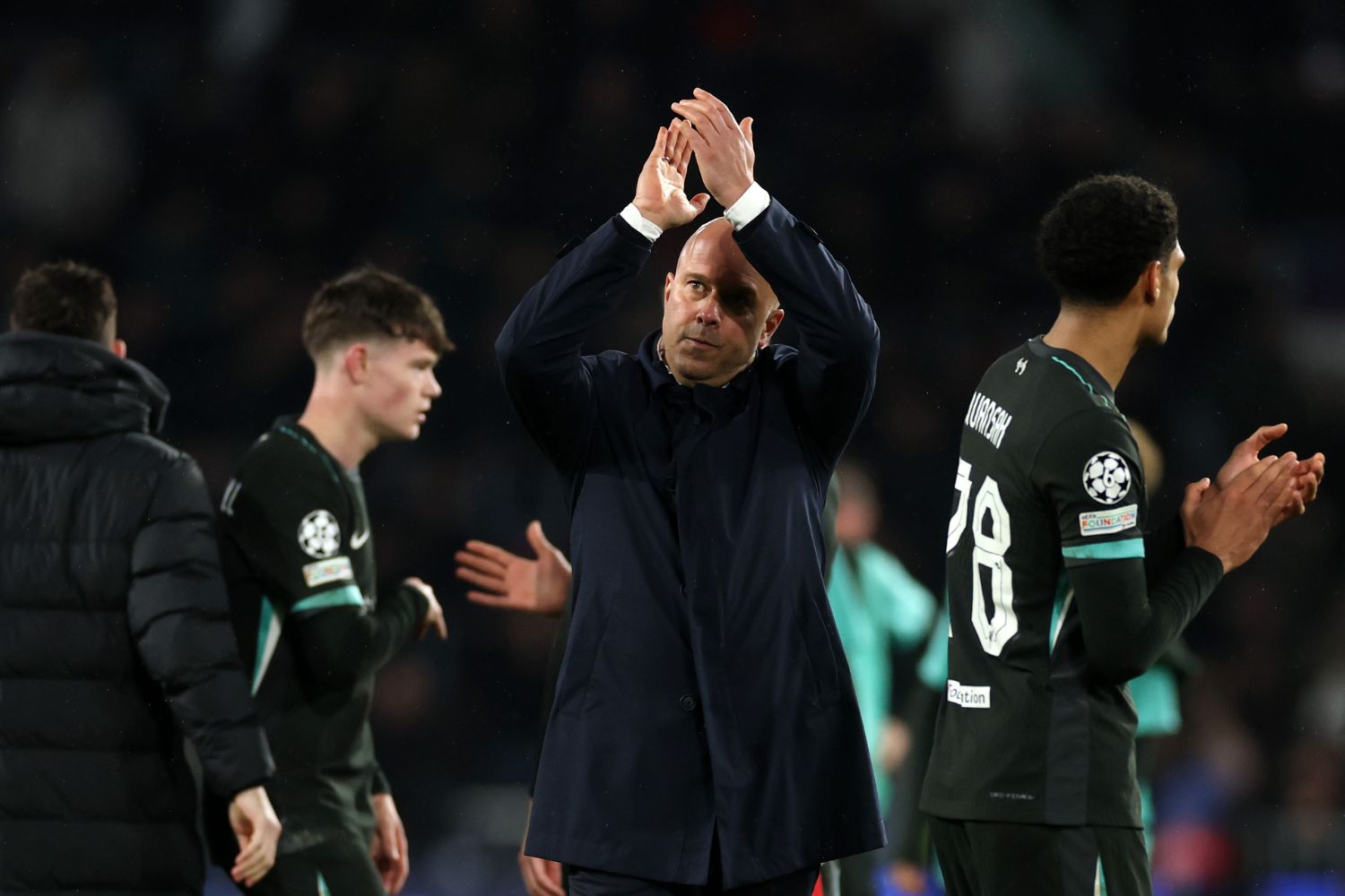Arne Slot applauds the Liverpool fans in PSV