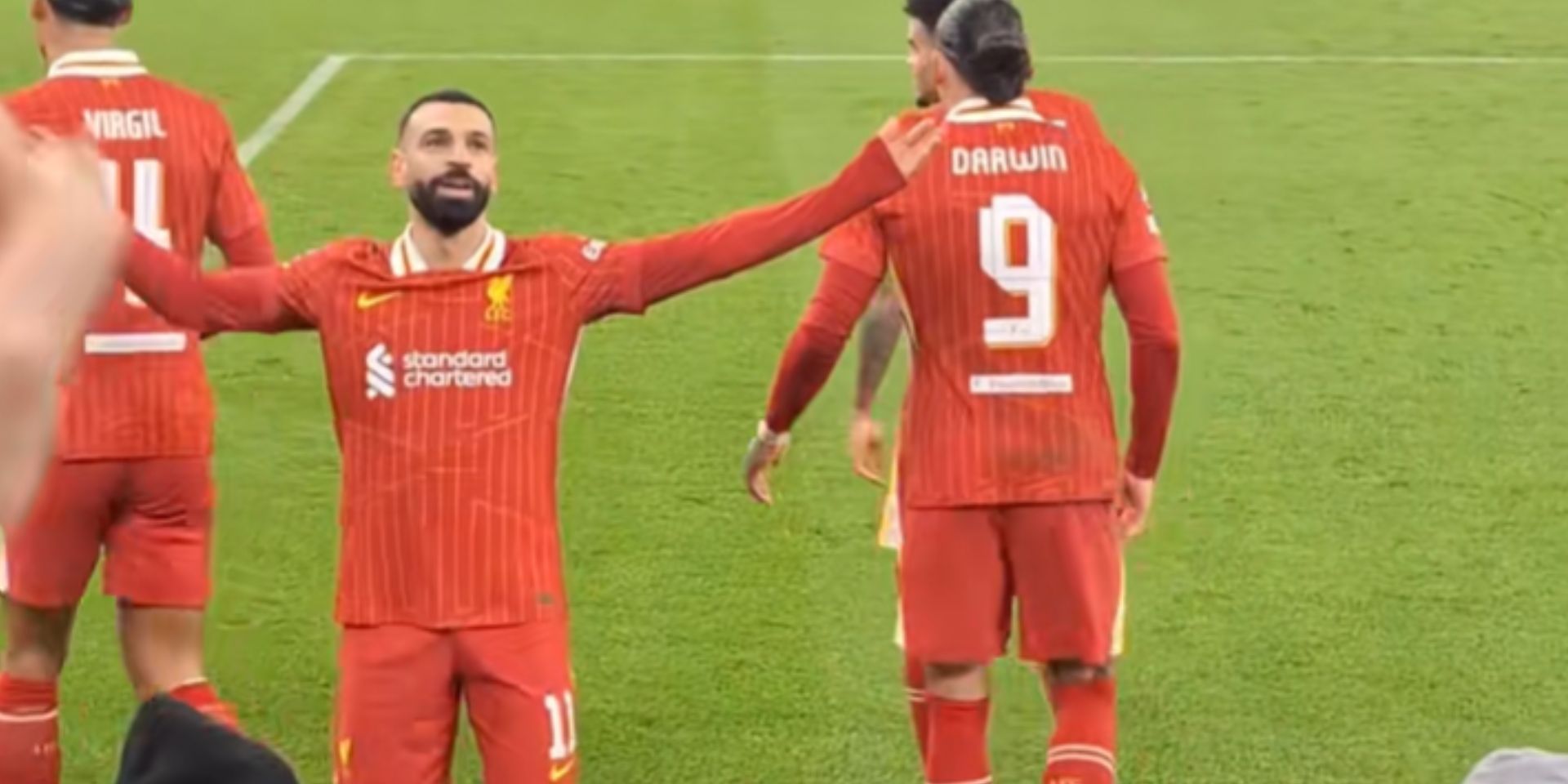Mo Salah celebrates in front of Liverpool fans after scoring against Lille