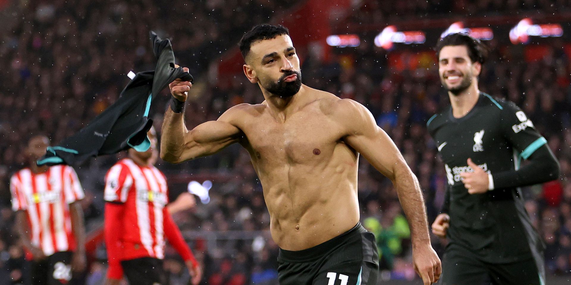 Mo Salah celebrates scoring against Southampton and takes his shirt off