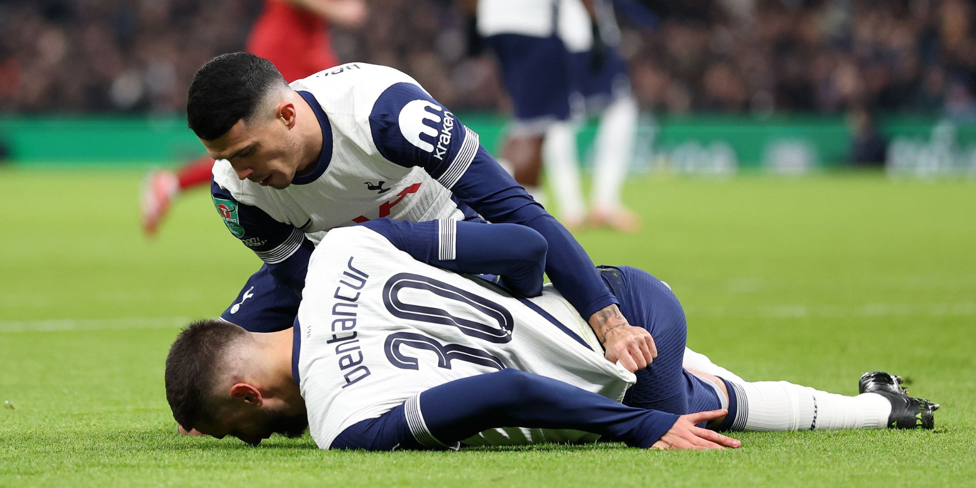 Rodrigo Bentancur injured on the floor for Tottenham