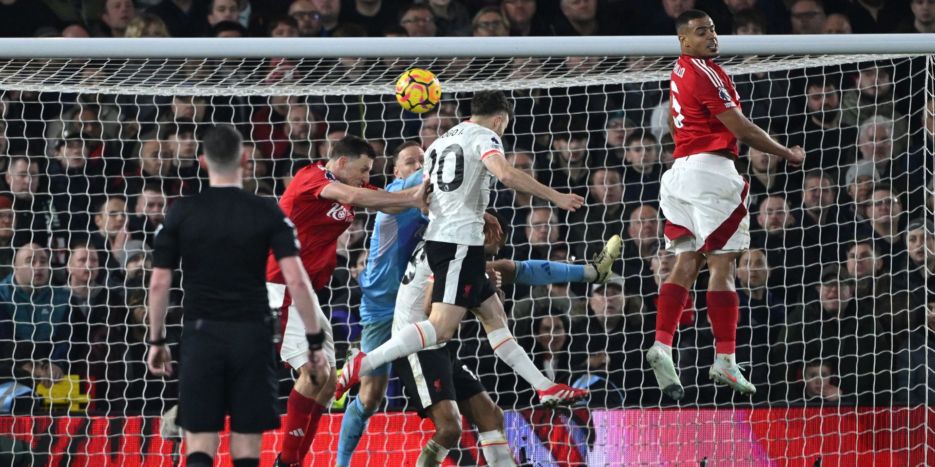 Chris Kavanagh watches on as Diogo Jota scores for Liverpool