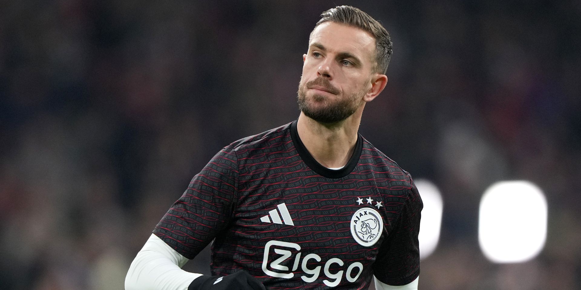 Jordan Henderson warms up for Ajax