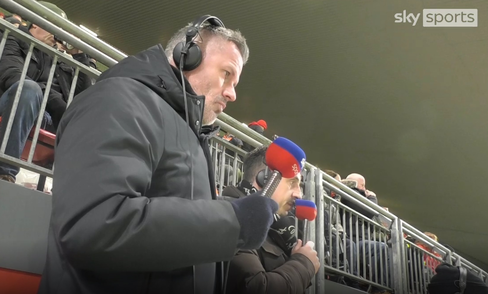 Jamie Carragher watching the Liverpool v Man United game at Anfield.