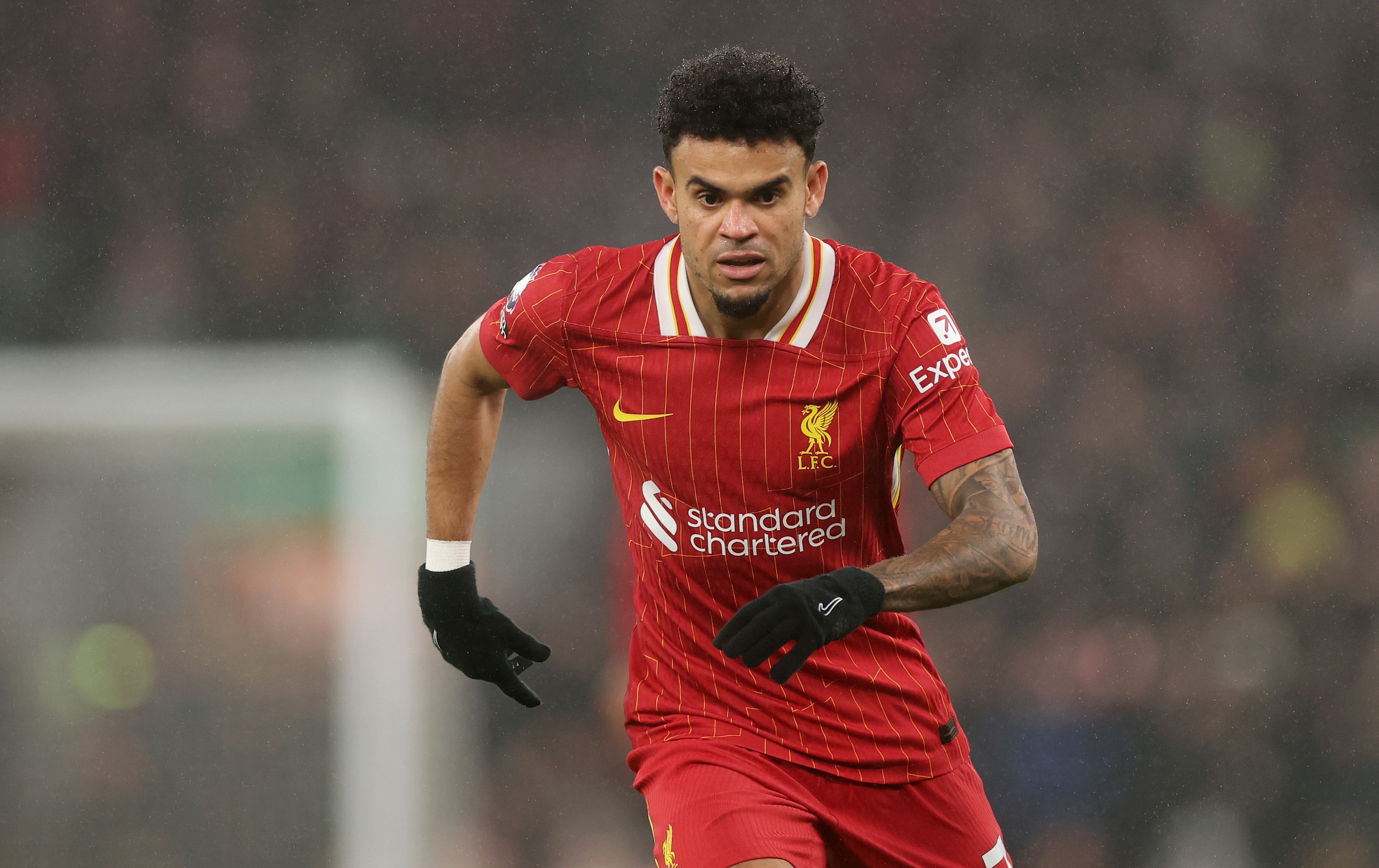 A determined looking Luis Diaz breaks into a run at Anfield.