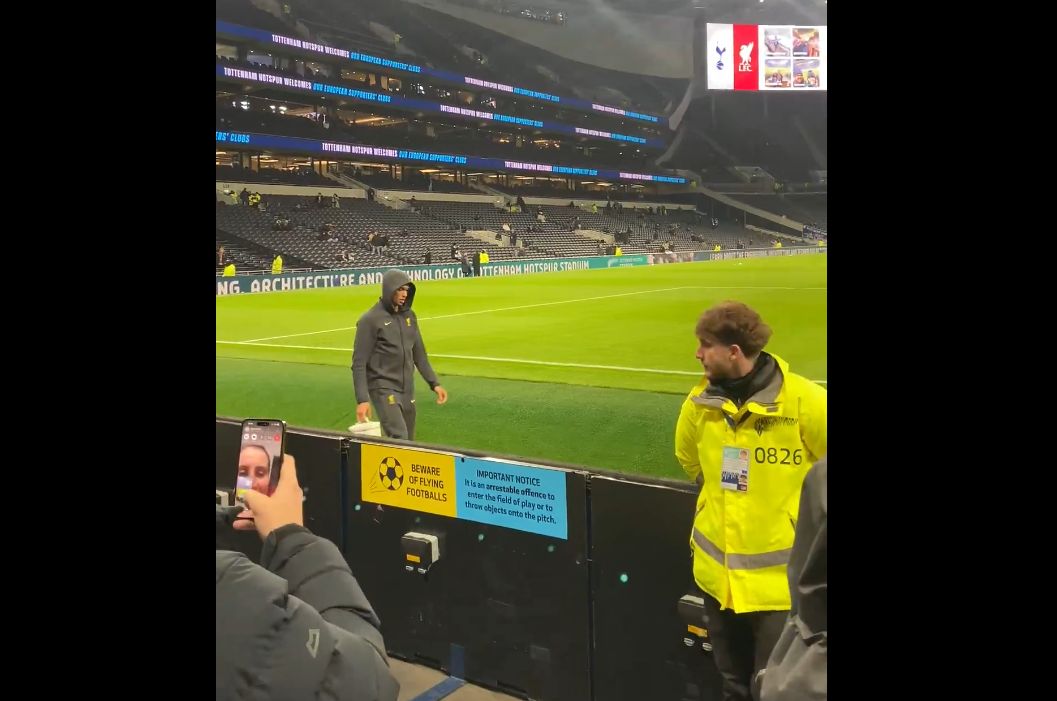 Trent Alexander-Arnold walks along the touchline in front of Liverpool fans in London.