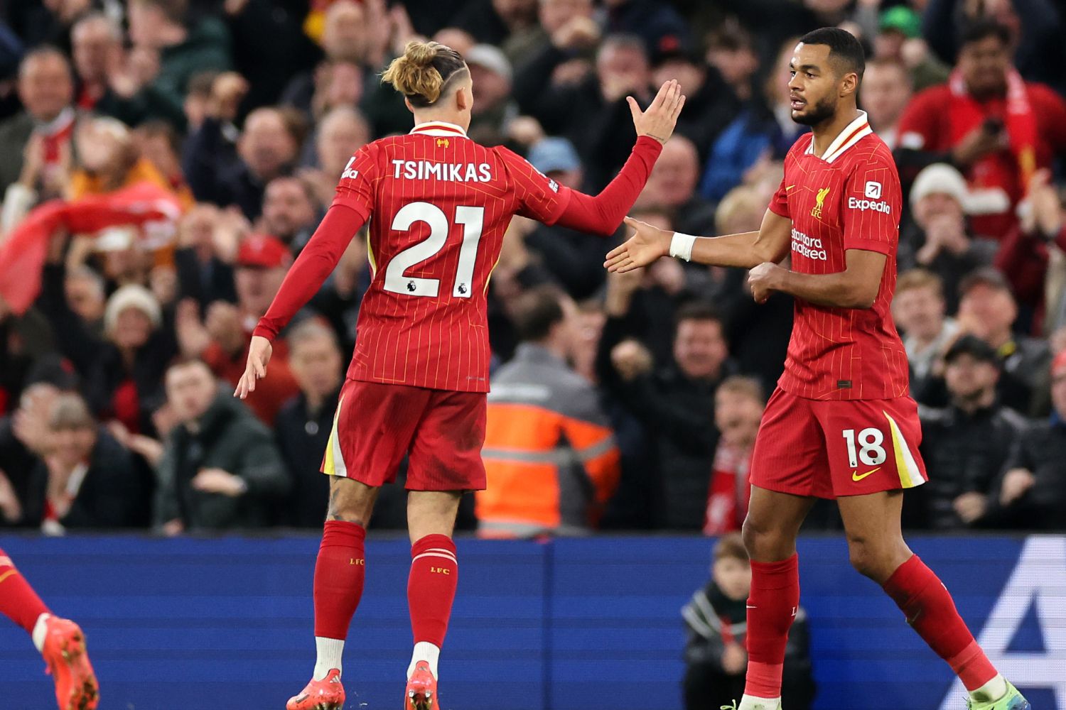 Kostas Tsimikas and Cody Gakpo celebrate at Anfield
