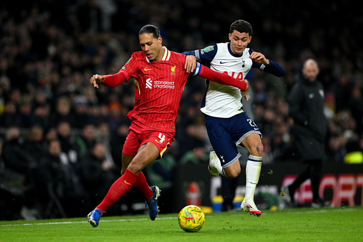 Virgil van Dijk competes against Tottenham