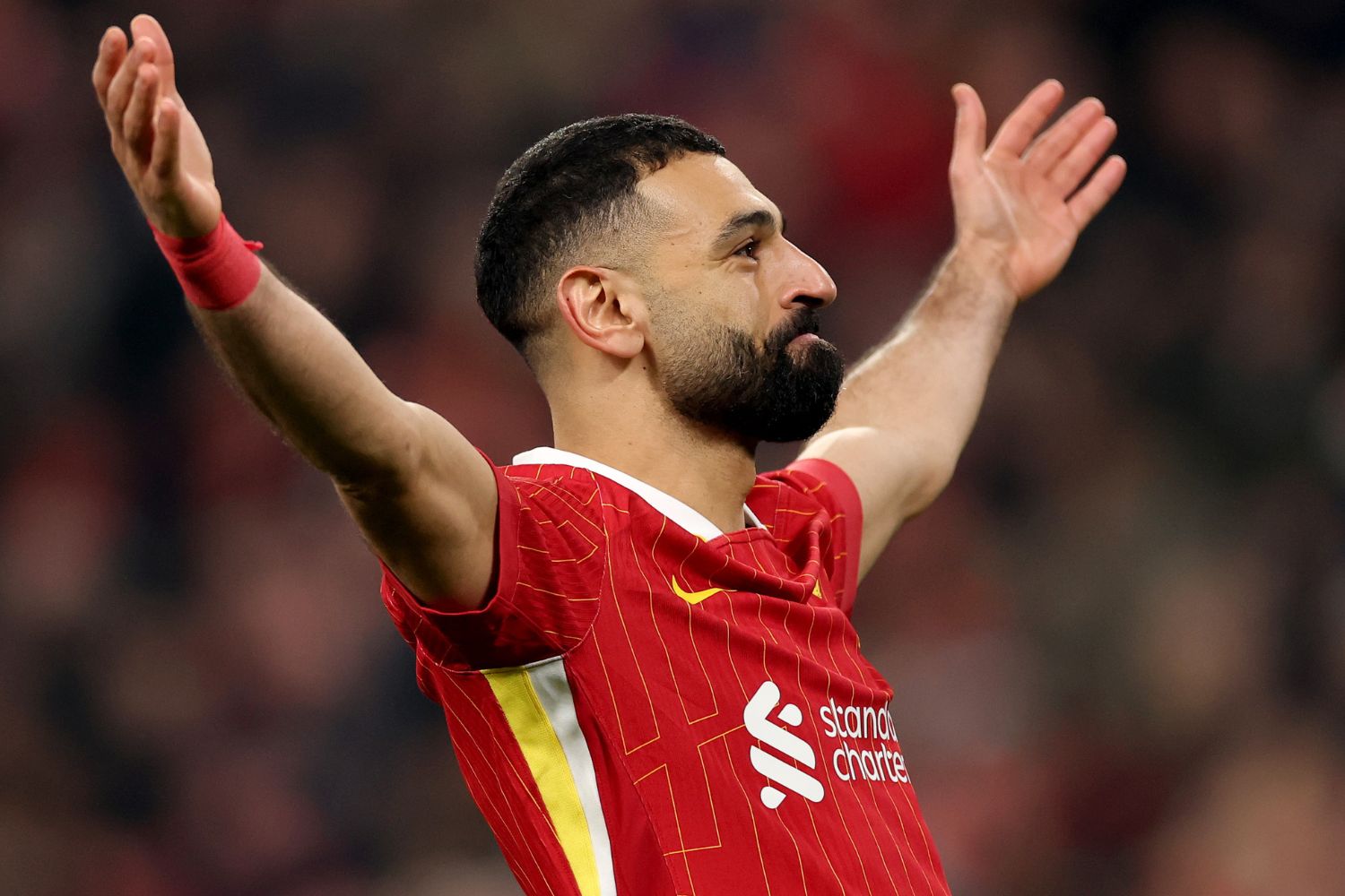 Mo Salah celebrates scoring against Tottenham