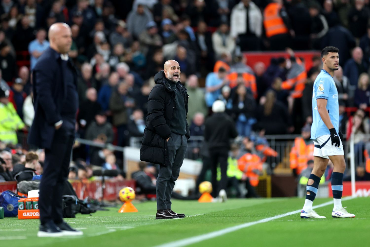 Pep Guardiola coaches at Anfield