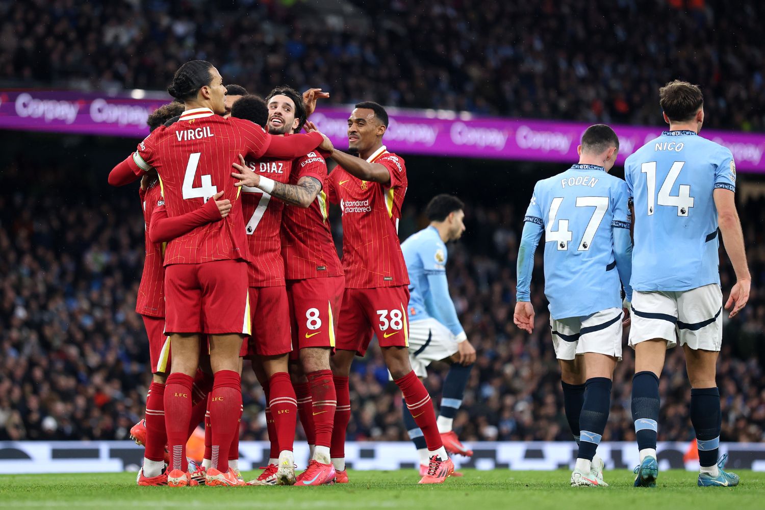 Liverpool celebrate scoring against Manchester City