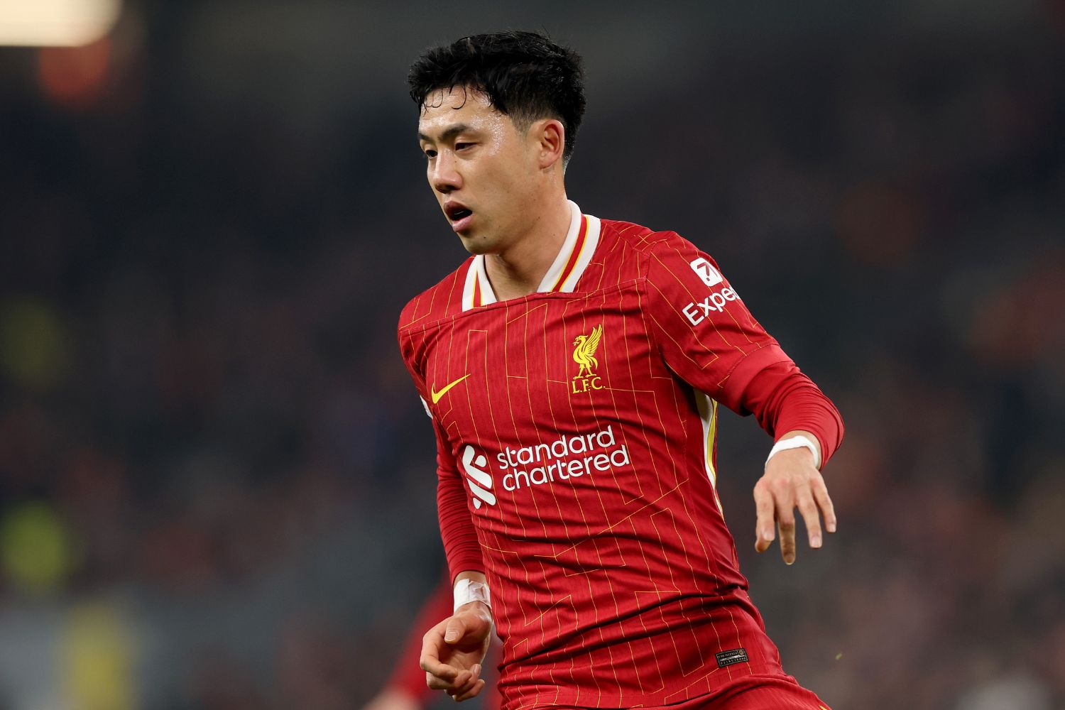 Wataru Endo playing for Liverpool at Anfield