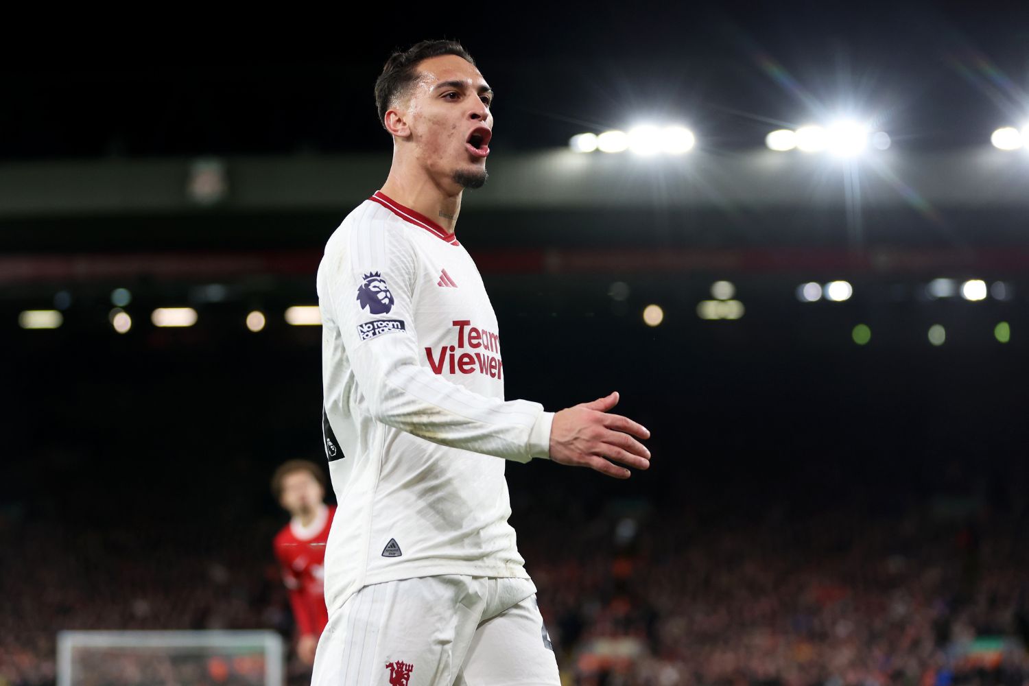Antony playing against Liverpool at Anfield