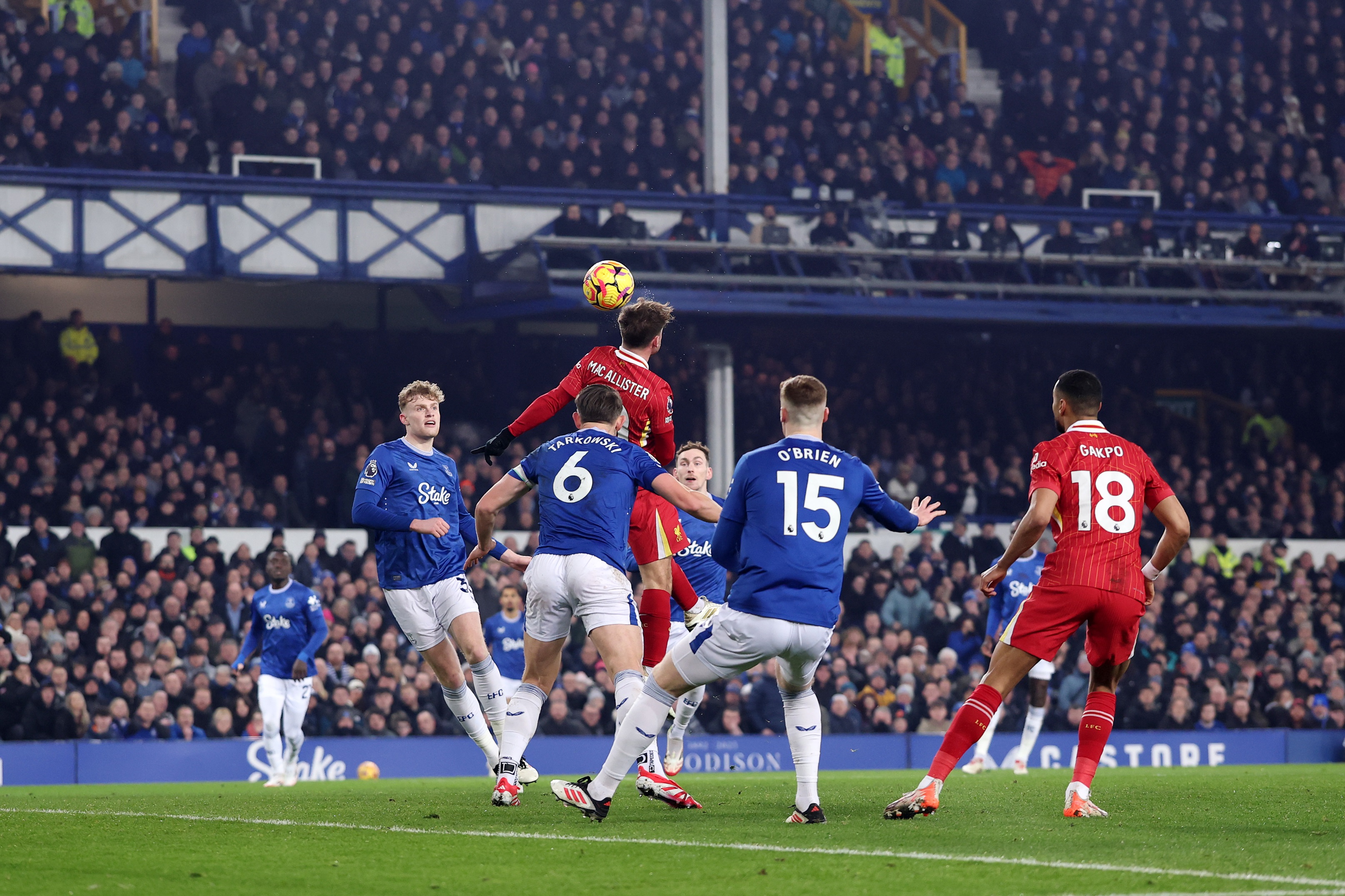 Alexis Mac Allister heads in Liverpool goal against Everton.