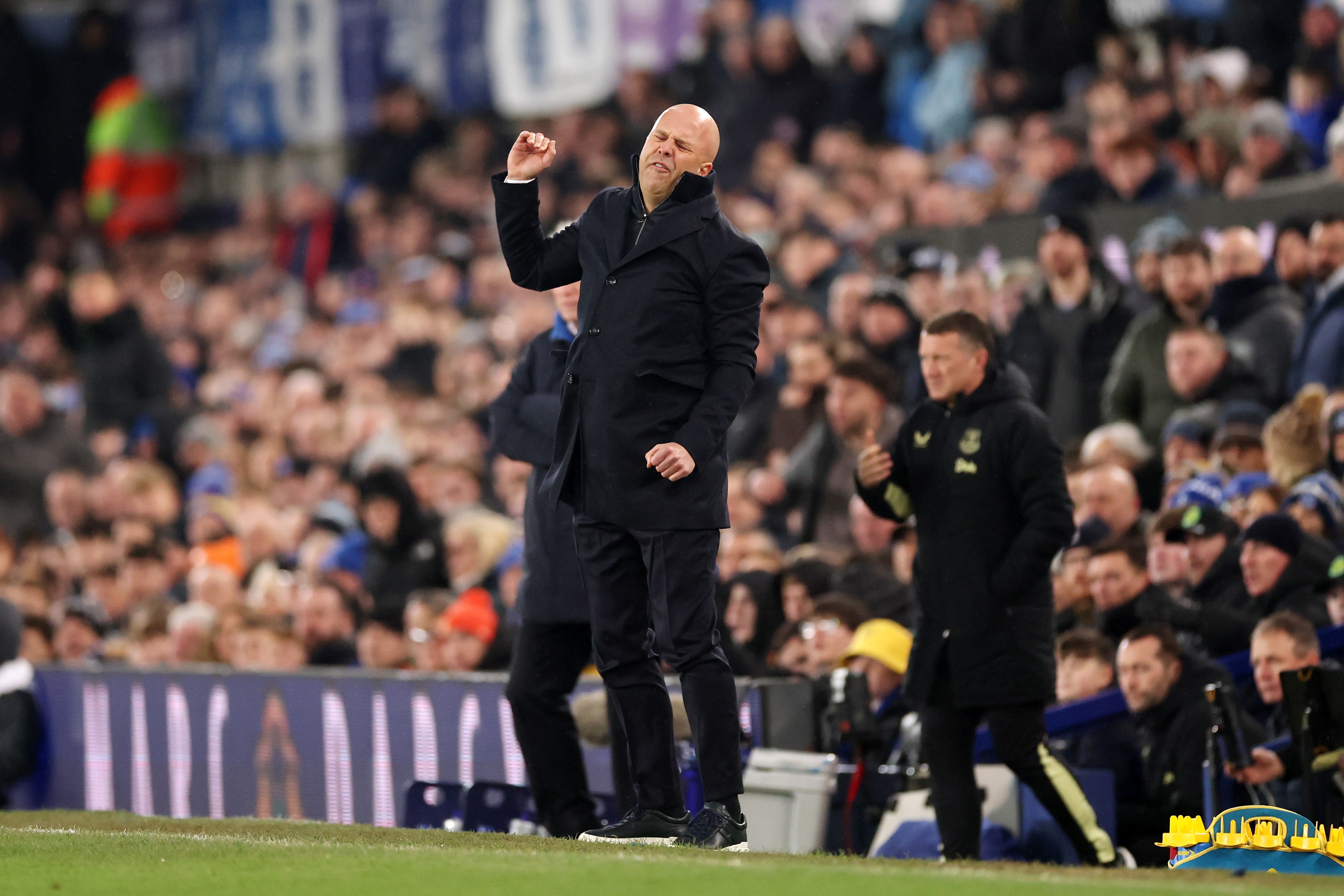Arne Slot throws his fist in frustration at Goodison Park.