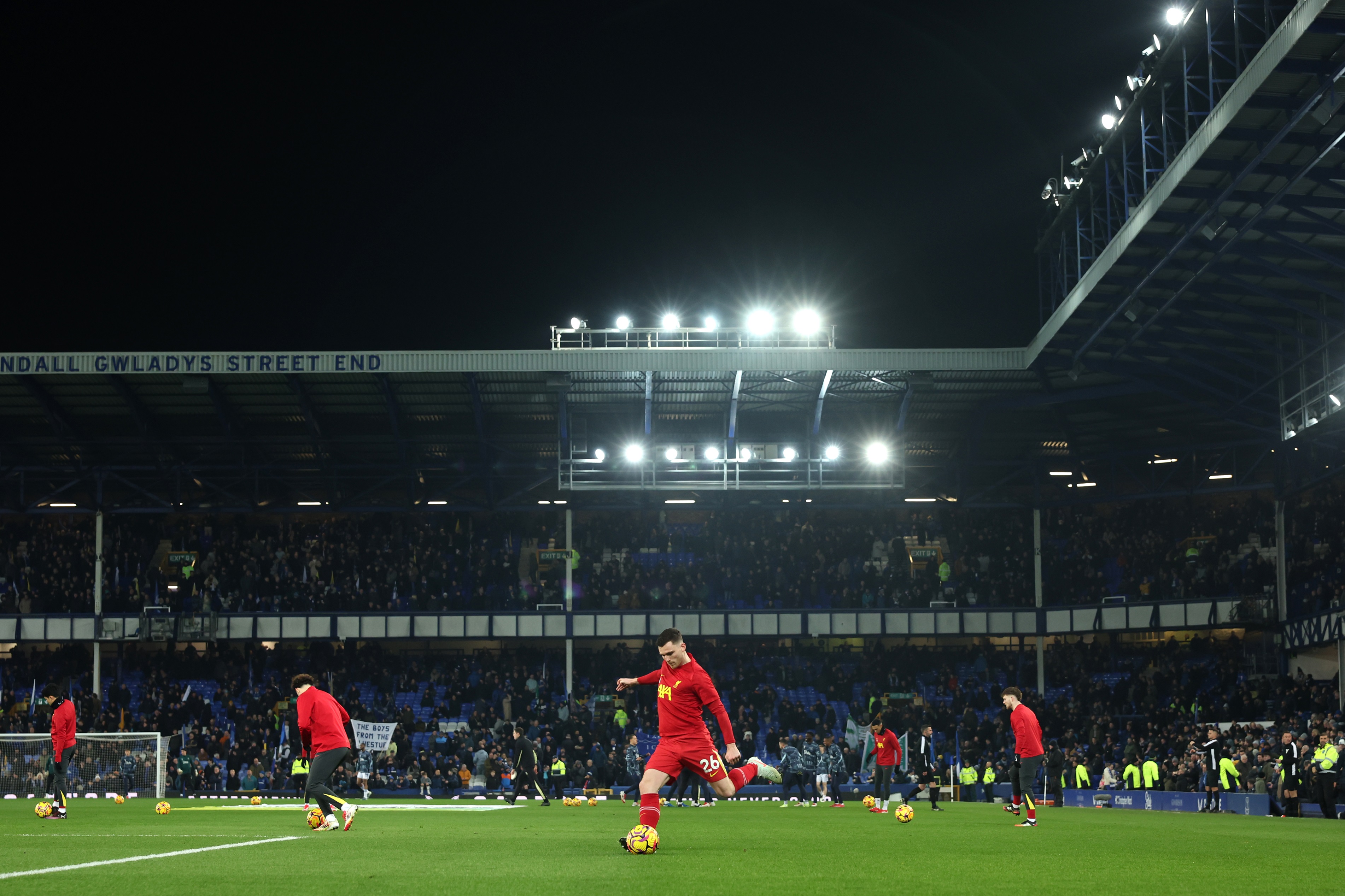 Andy Robertson and Liverpool FC teammates warm up at Goodison Park.