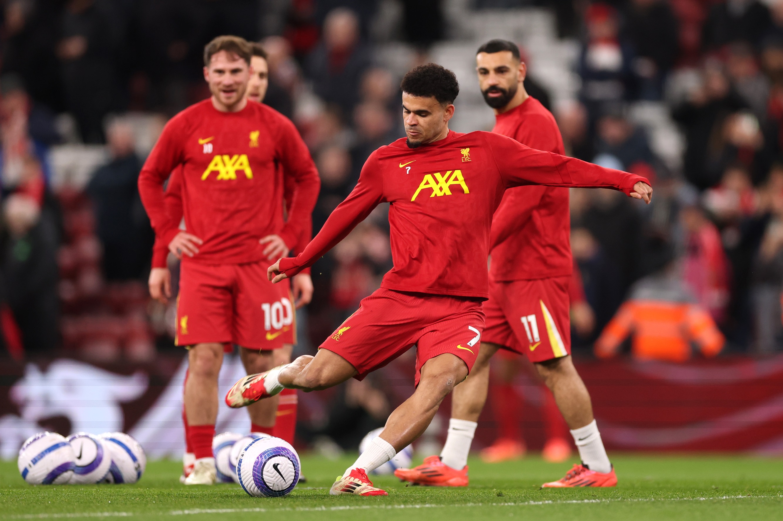 Luis Diaz strikes the ball during a Liverpool warm-up.