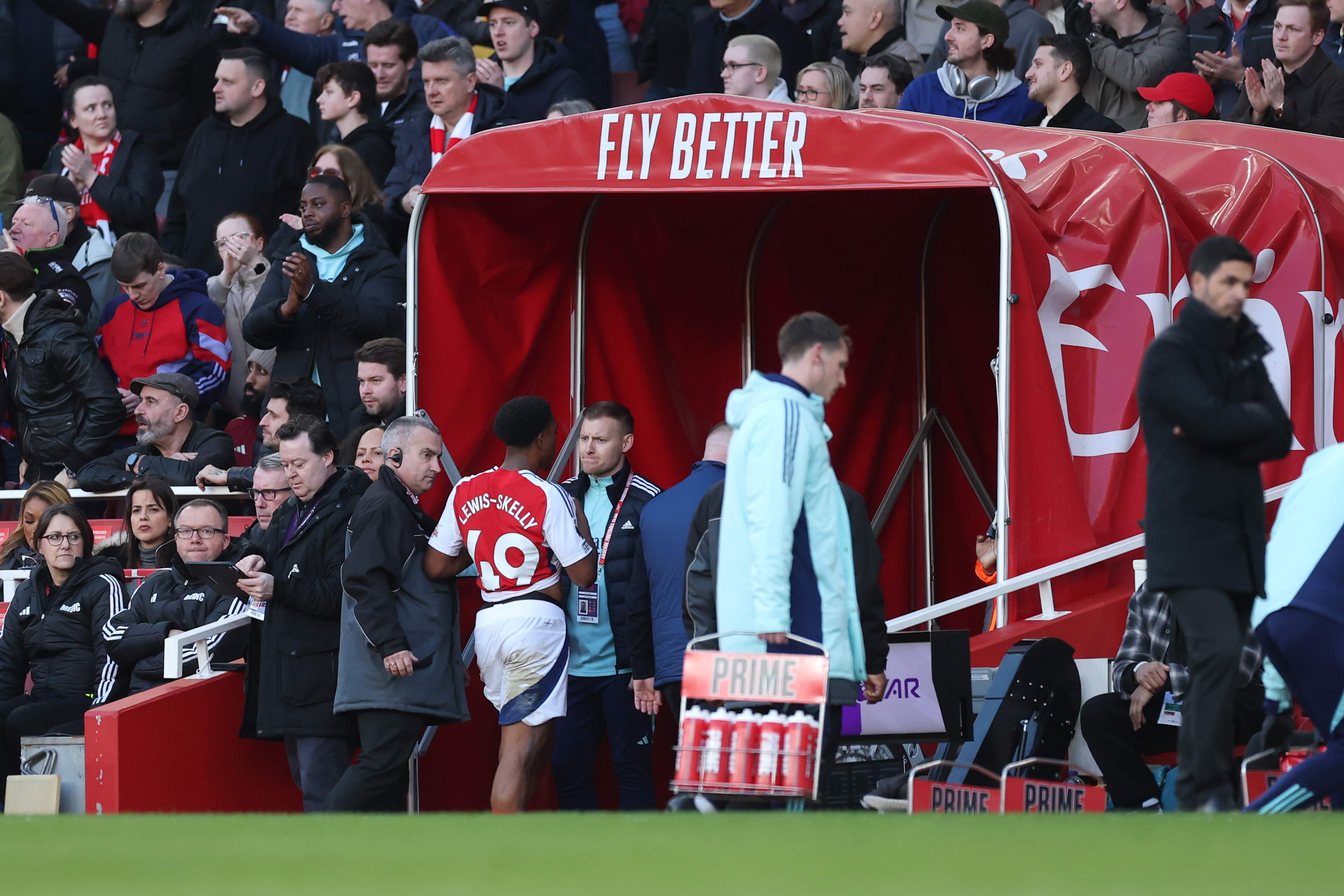 Myles Lewis-Skelly walks down the tunnel at the Emirates Stadium.