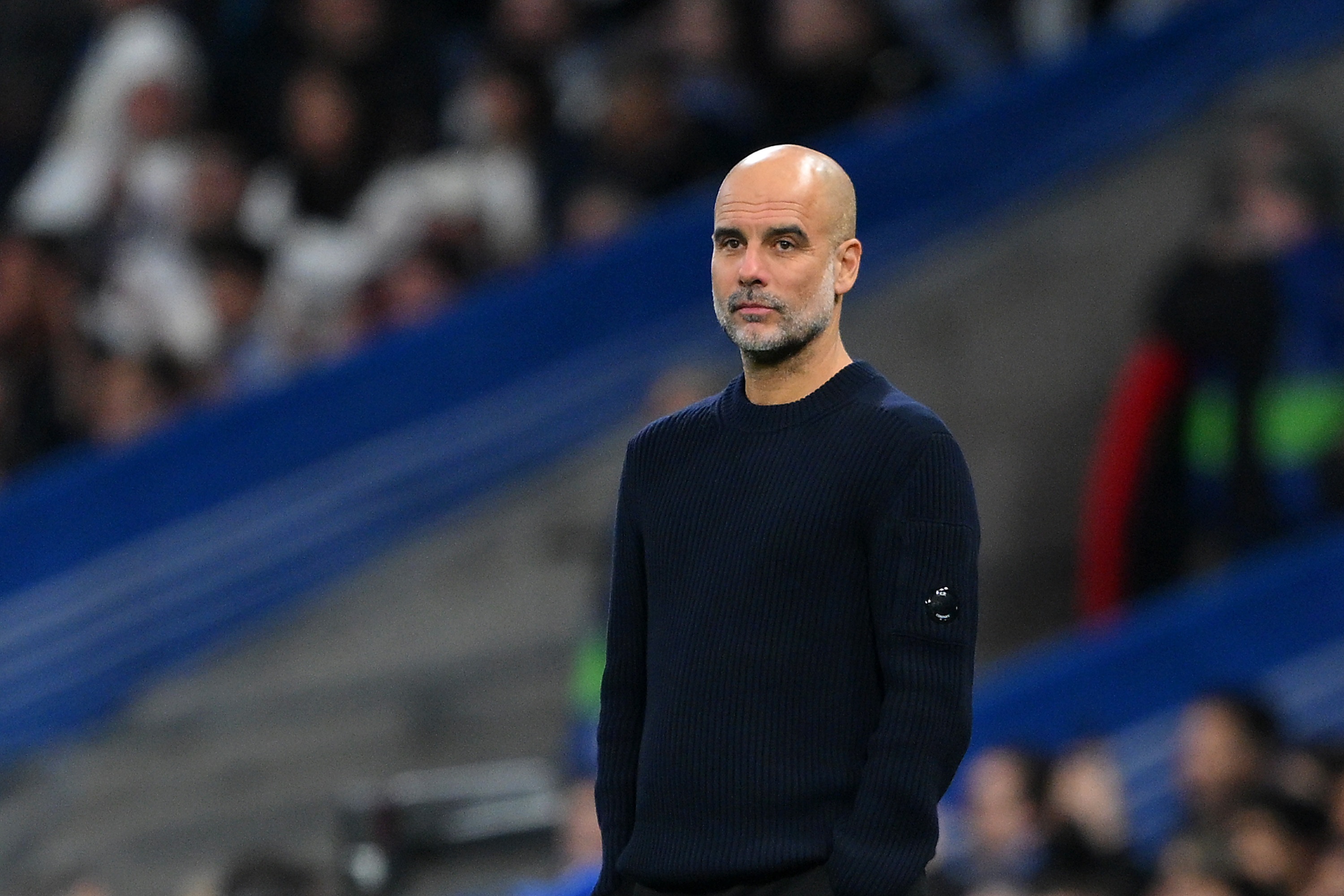 Pep Guardiola looks on during Real Madrid v Man City.