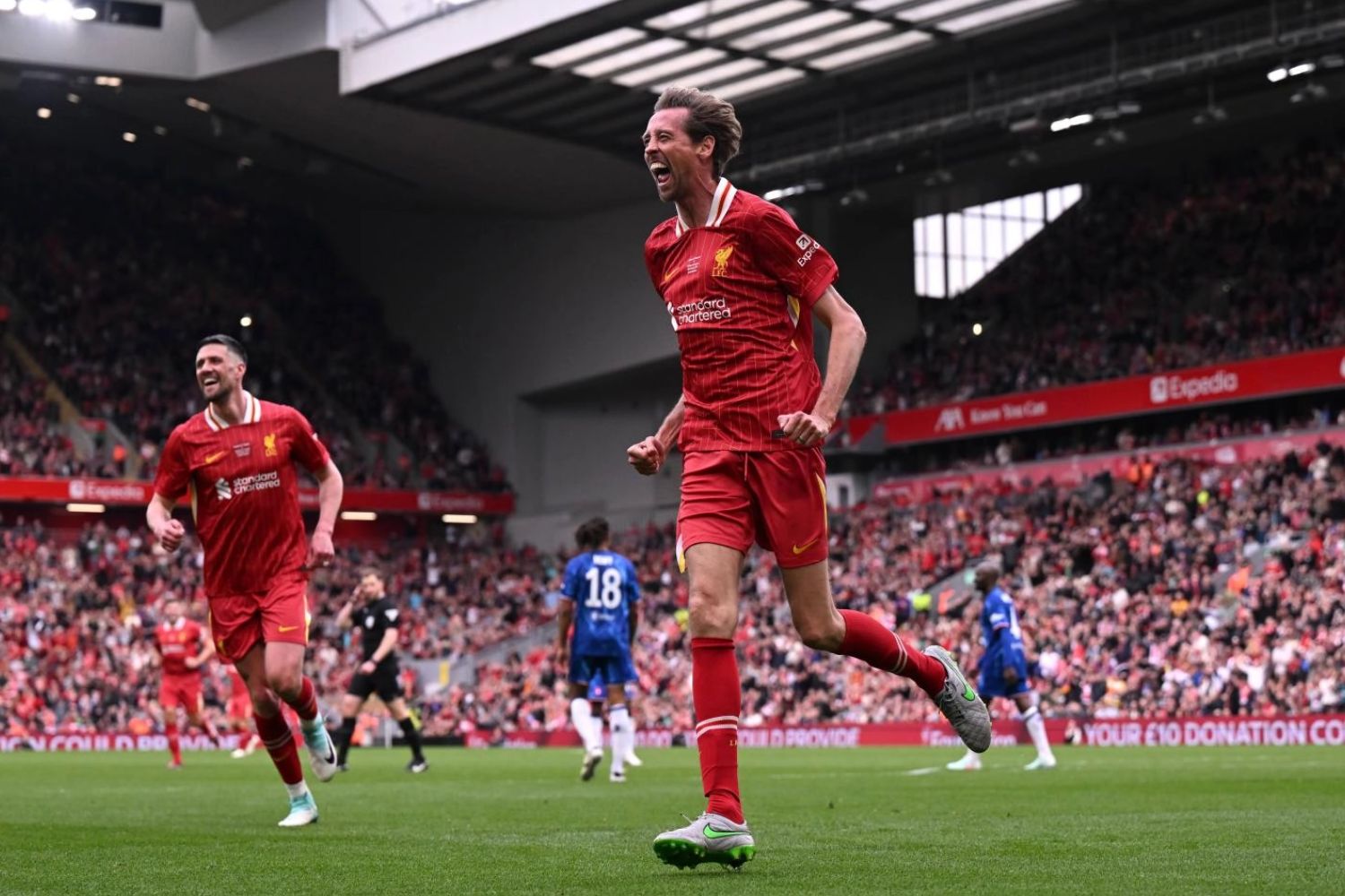 Peter Crouch celebrates after scoring against Chelsea Legends