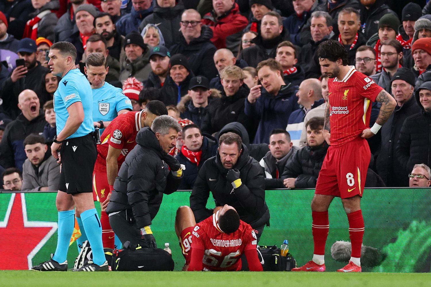 Trent Alexander-Arnold lays injured on the floor against PSG