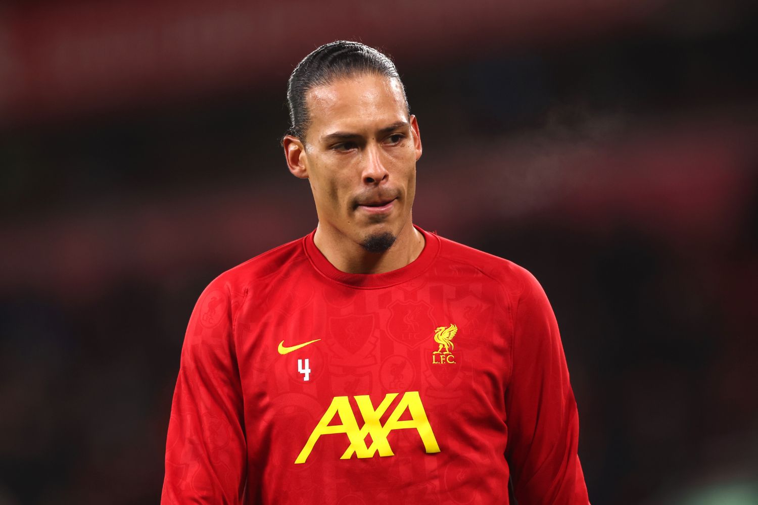 Virgil van Dijk warming up for Liverpool