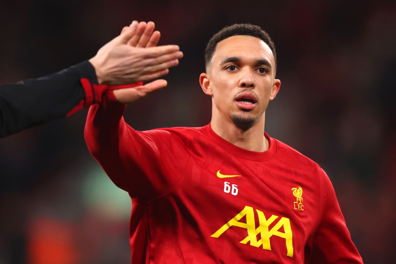 Trent Alexander-Arnold warms up at Anfield for Liverpool