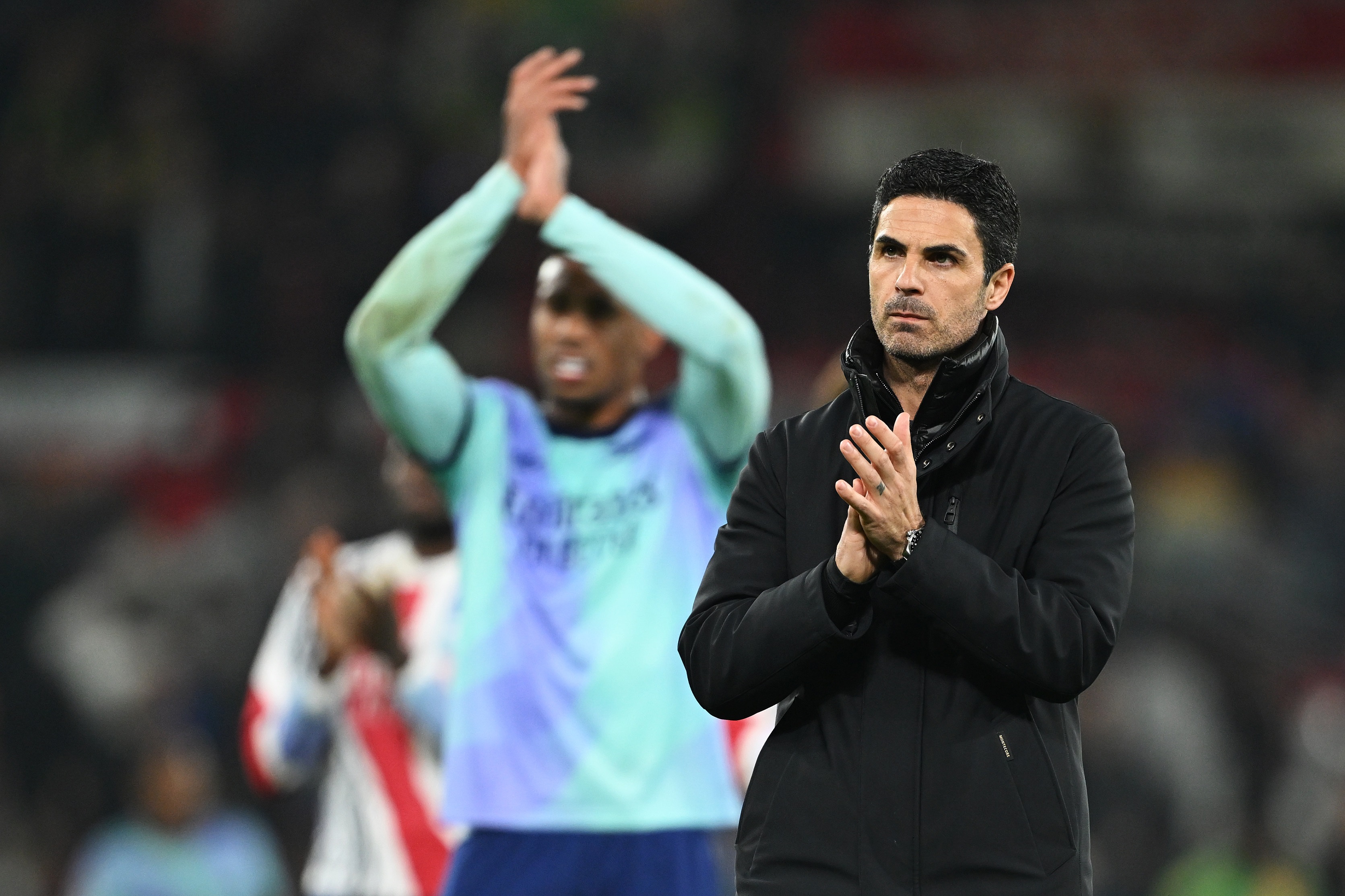Mikel Arteta claps the Arsenal away fans at Old Trafford.