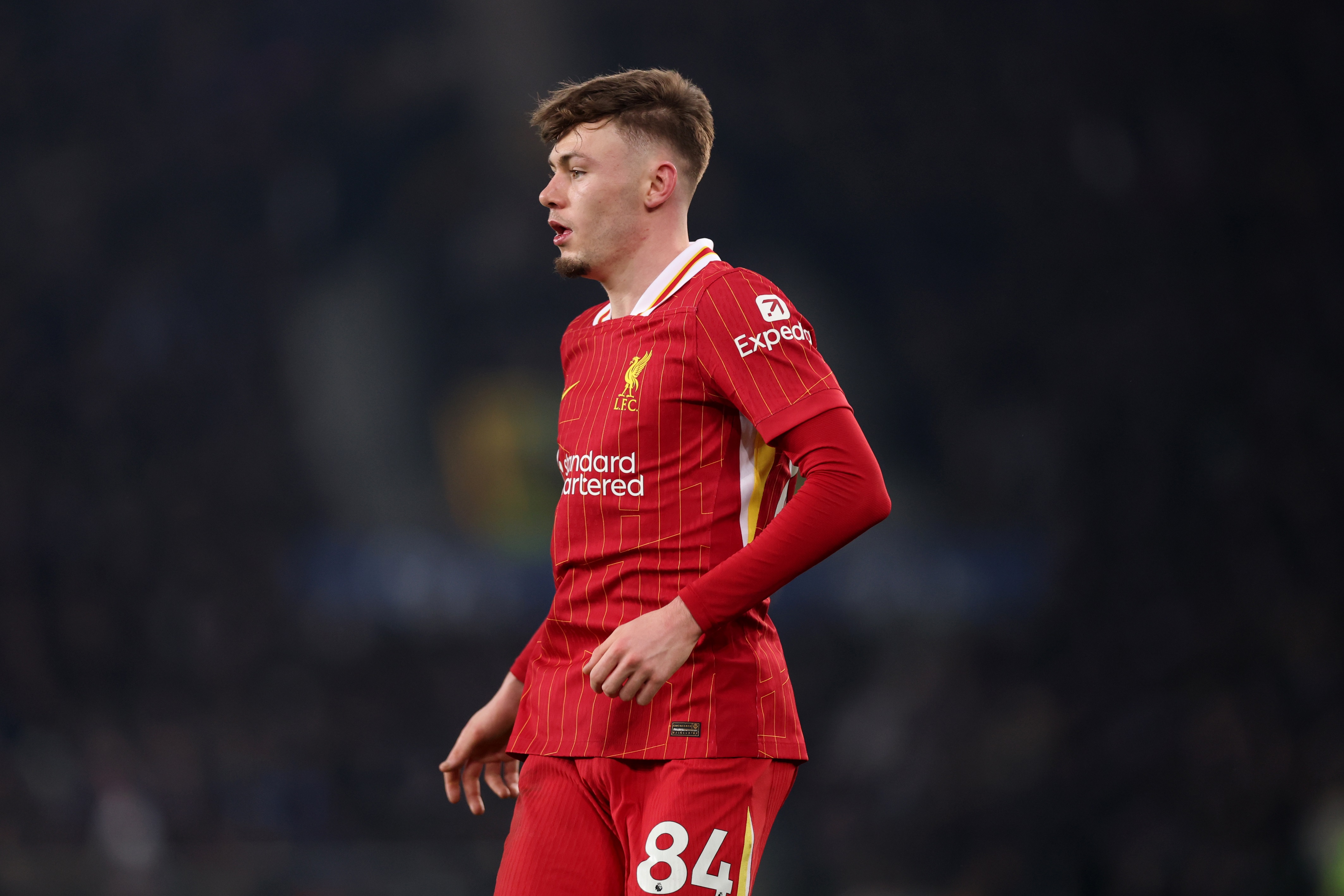 Conor Bradley looks out on to the pitch.